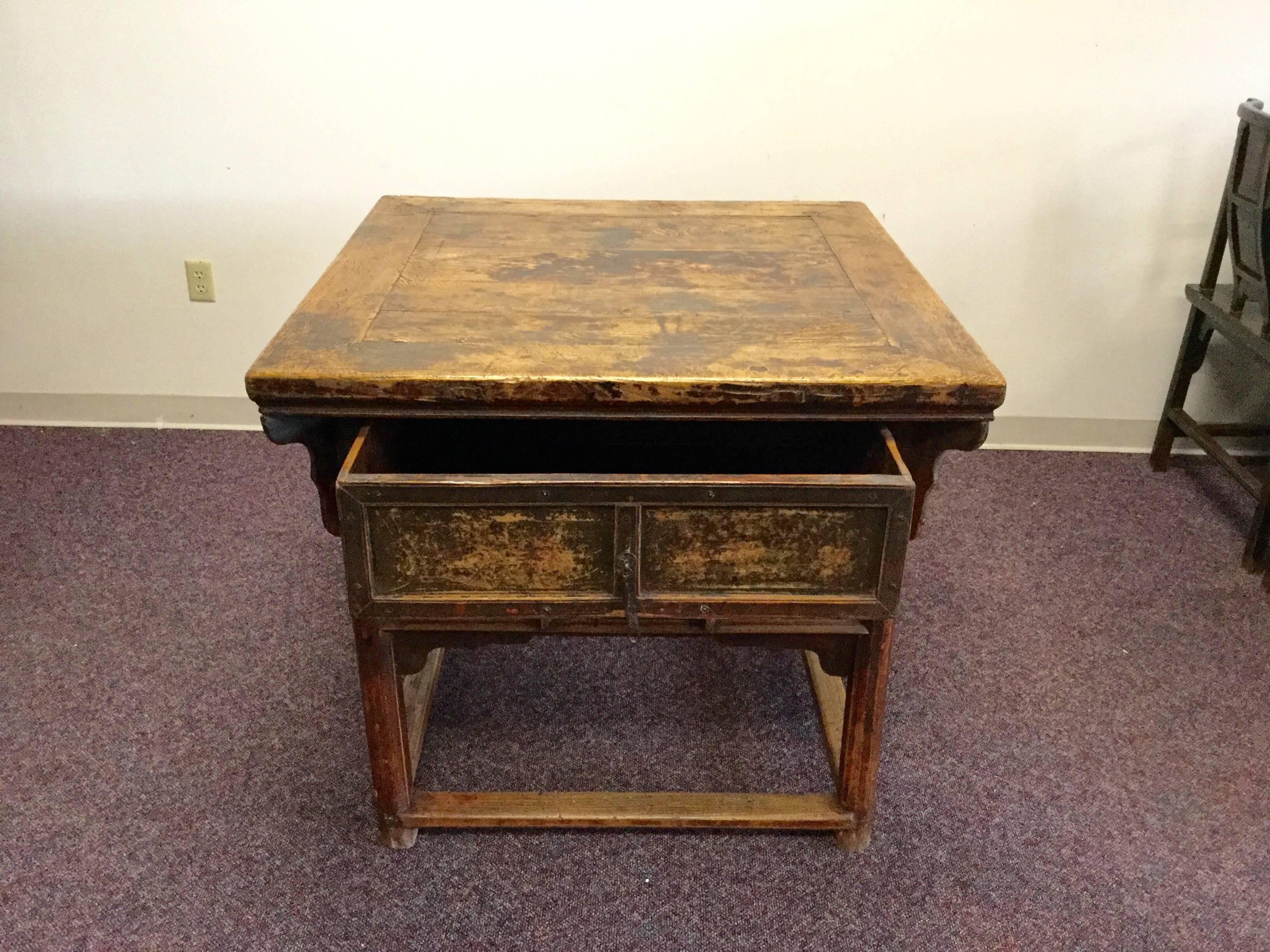 This wonderful piece was handcrafted from walnut then painted with a charming lotus blossom motif.
Over 130 years old from Gansu Province where it originally served as a kitchen island, it has acquired a rich patina and the character of the