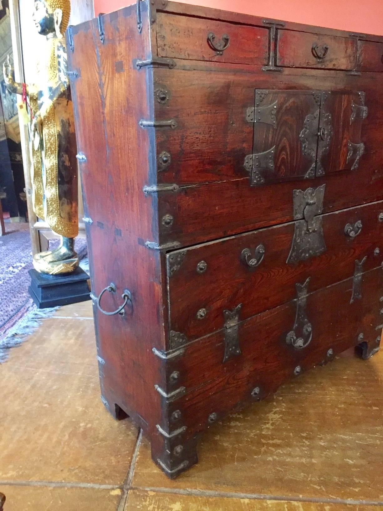 Crafted of solid woods, this chest features wonderful handmade hardware and rivets.
There are three small drawers as well as two larger compartments.