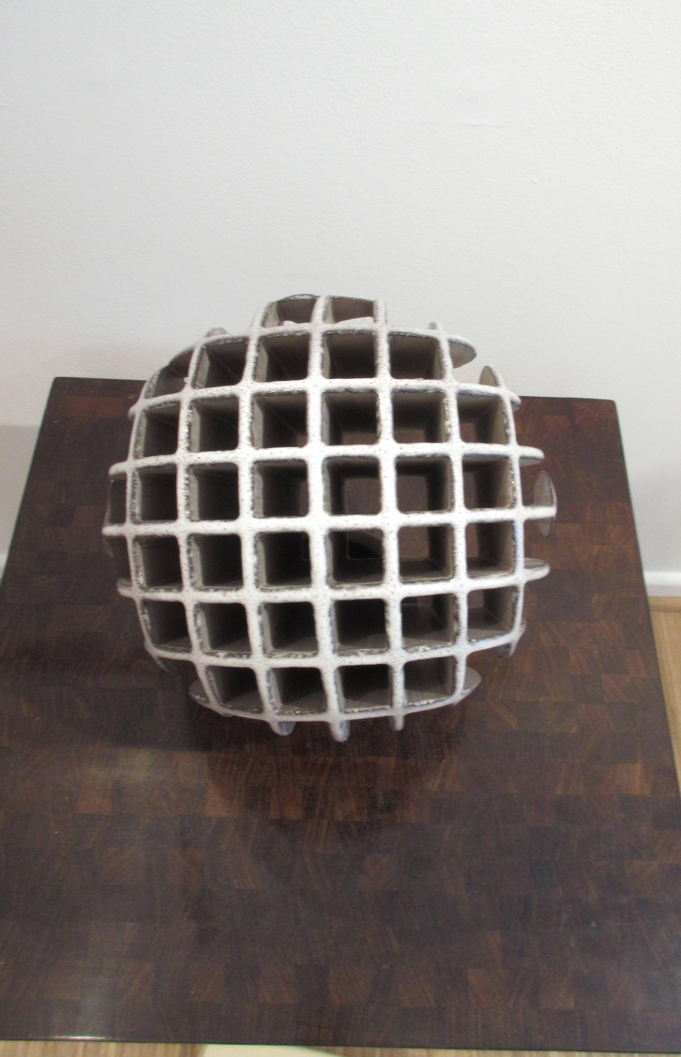 Sphere sculpture by Alessio Tasca (born in 1929). Captivating contrast of open and solid form can be rotated on separate ring base. Signed with mark, early 1970.
Measures:
Height 24.5 cm (28 cm with ring).

Diameter 24 cm.

