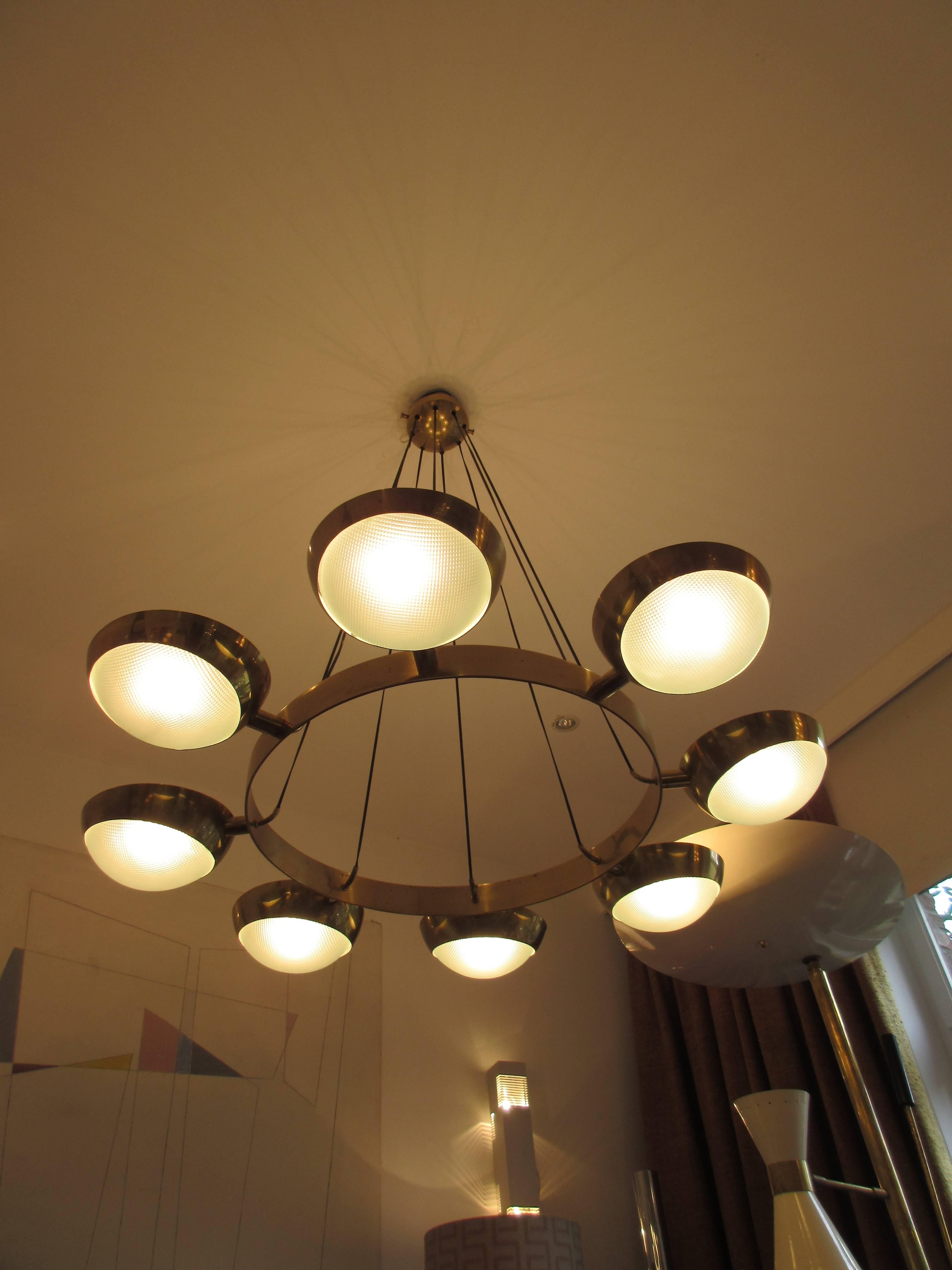 Polished brass ceiling lamp with eight lamps by Gino Sarfatti, Italy.

Height +/- 94 cm.

Width +/-+ 104 cm.

Diameter of the globes +/- 21 cm.

Gino Sarfatti (1912–1984) studied aeronaval engineering at the University of Genoa. From 1939