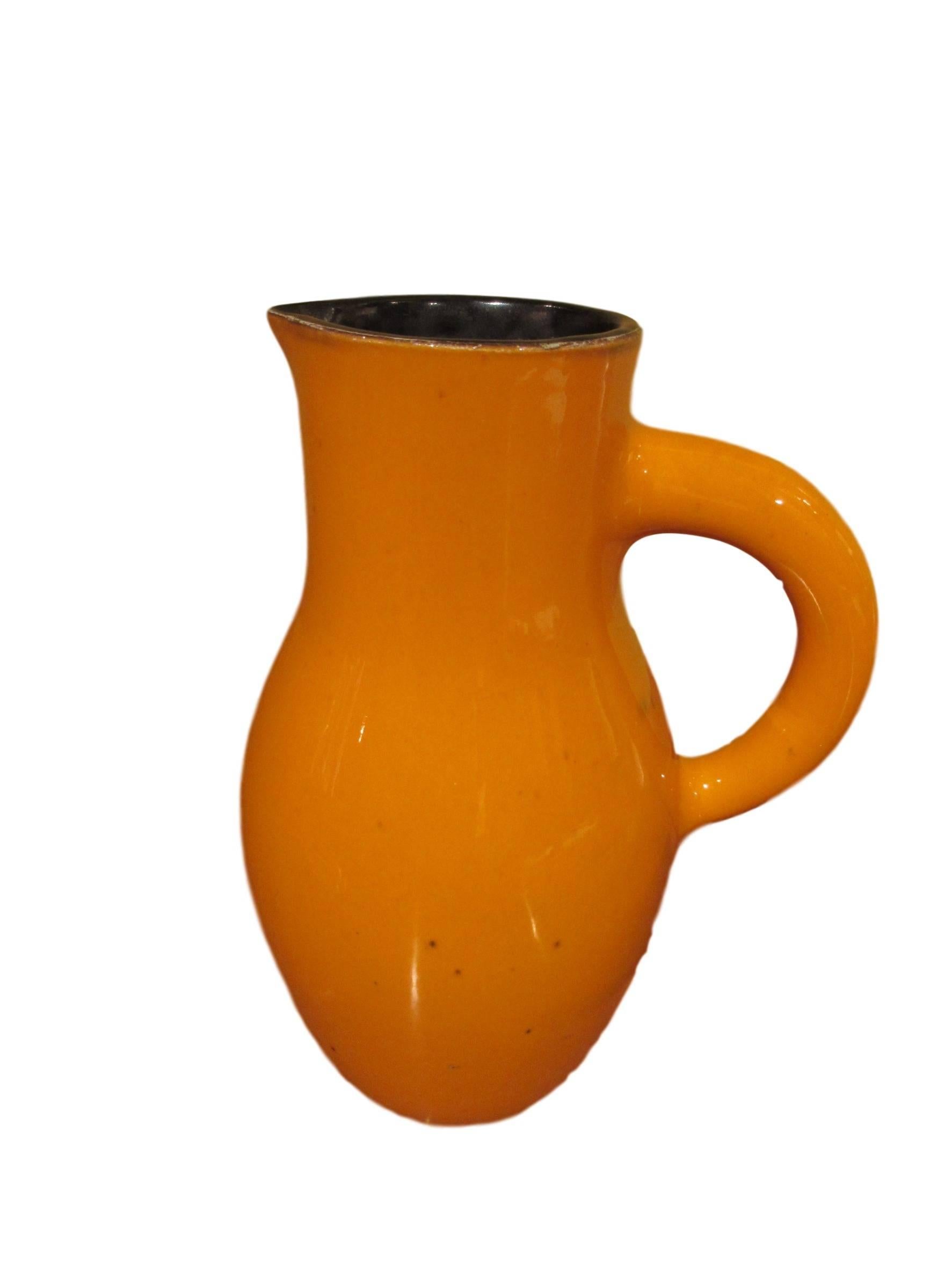 Ceramic carafe by Georges Jouve, signed.

Georges Jouve is an impotant ceramist of the 20th century. He was born in 1910 in Fontenay-sous-Bois and his parents were both decorators. At 17 years old, Jouve enrolled at the prestigious Ecole Boulle in
