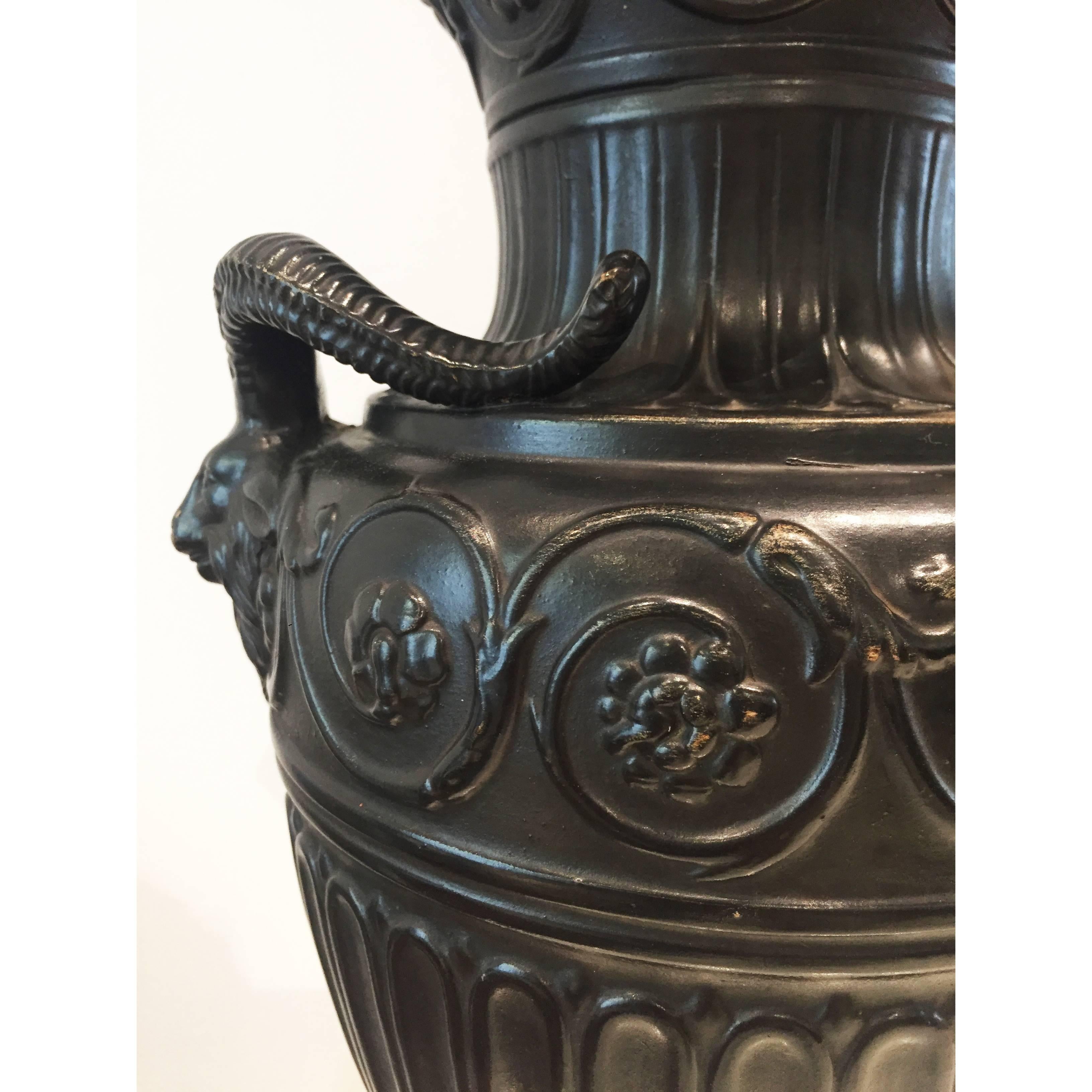 Magnificent antique basalt style Amphora vase from the company of Gerbing & Stephan Marks (1885-1910) with embossed detailing from 1890s.

The vase of baluster form with twin ornate acanthus handles rising from the shoulder; the whole resting on