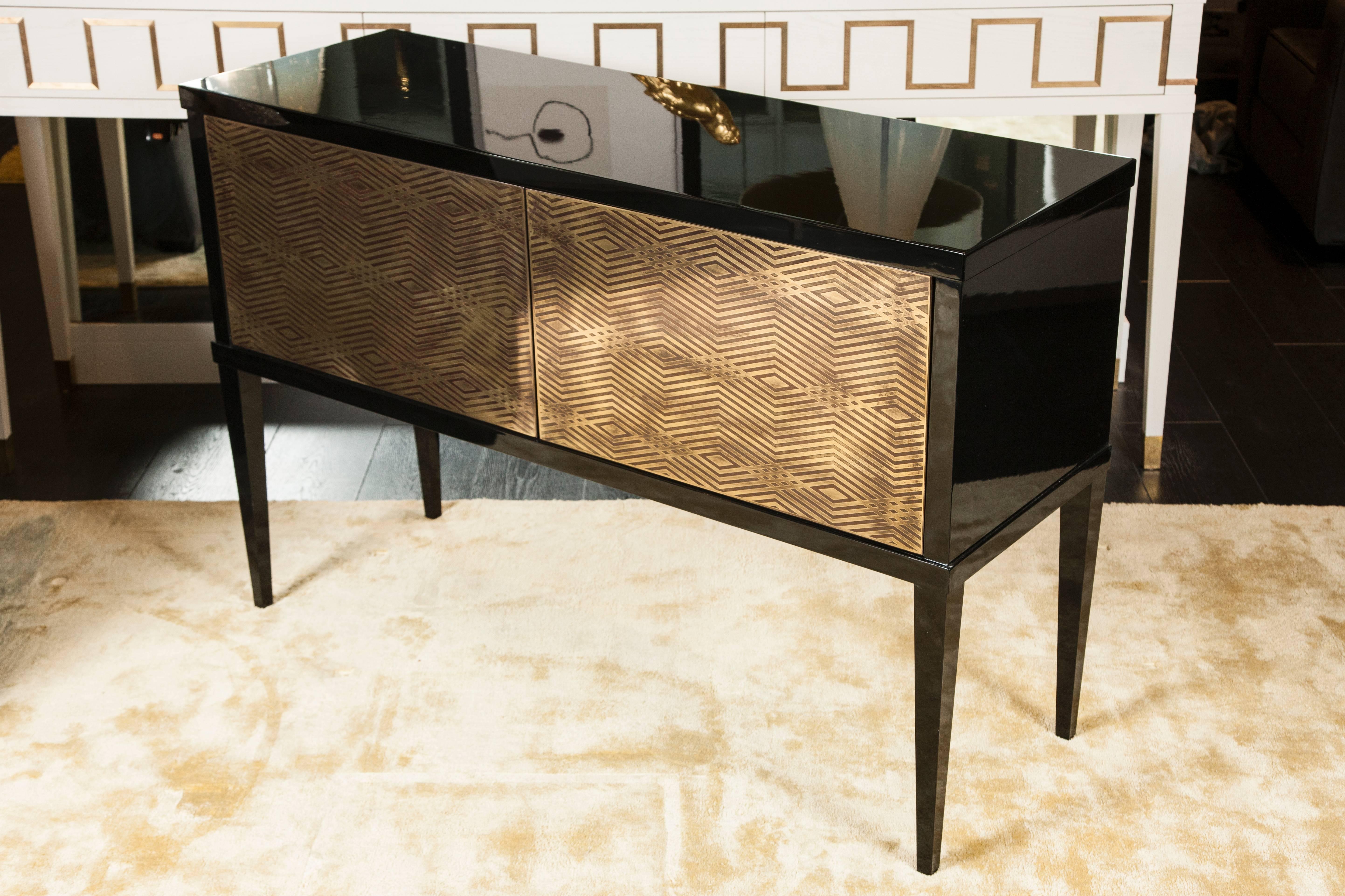 Piano lacquered cabinet with brass detailing.

Available in custom color lacquer.

As part of our signature collection, each piece is handmade in our workshop and is available in bespoke sizes. For further information please request a quotation.