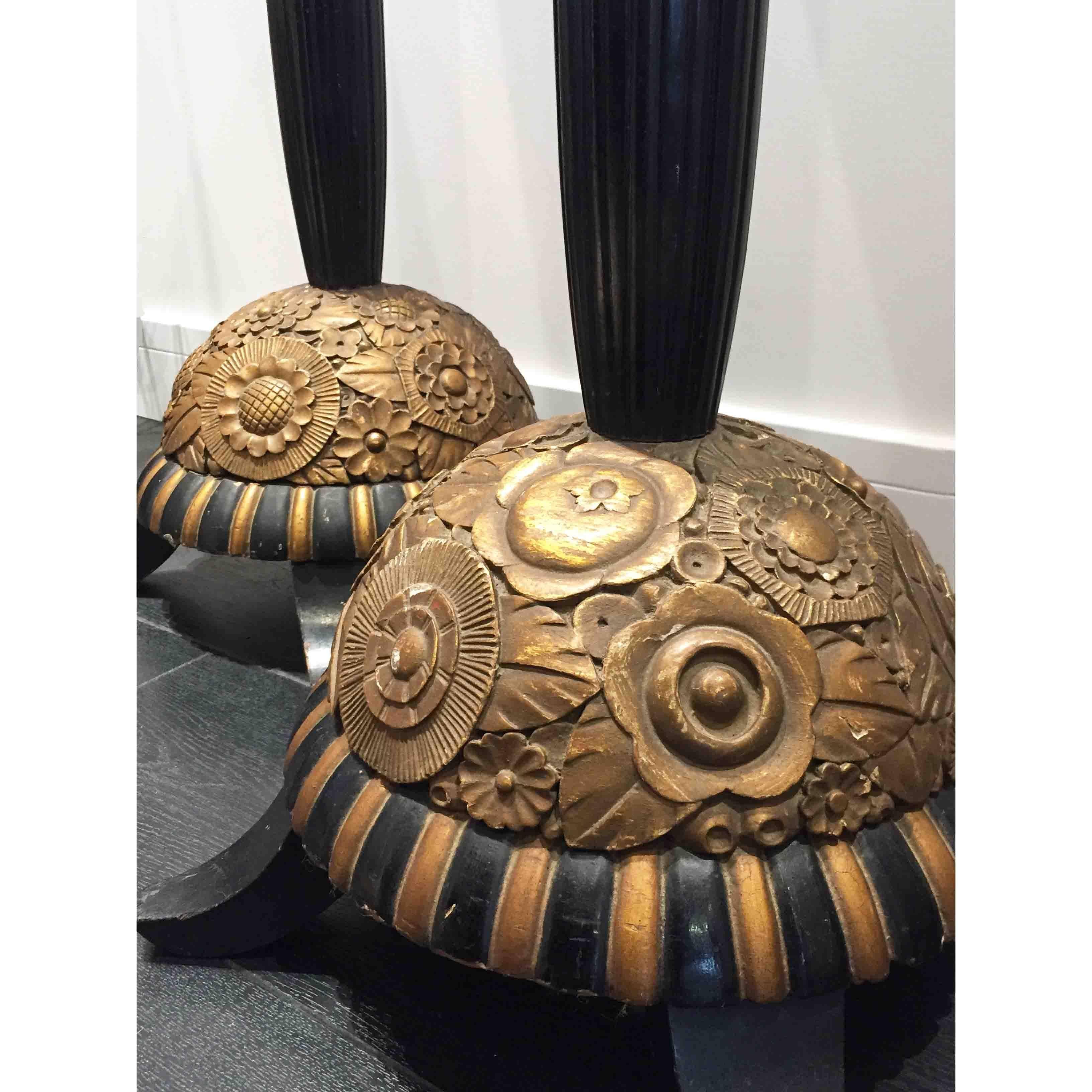 Gold and black French Art Deco floor lamps from 1920’s with carved wooden base and centre pole. Sold as a pair.

38Dia x 170H cm

Good vintage condition considering the age