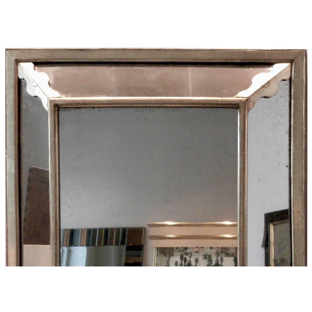 Beautiful large French mirror, silver frame with gold trim. Featuring its original glass plate. Good antique condition.