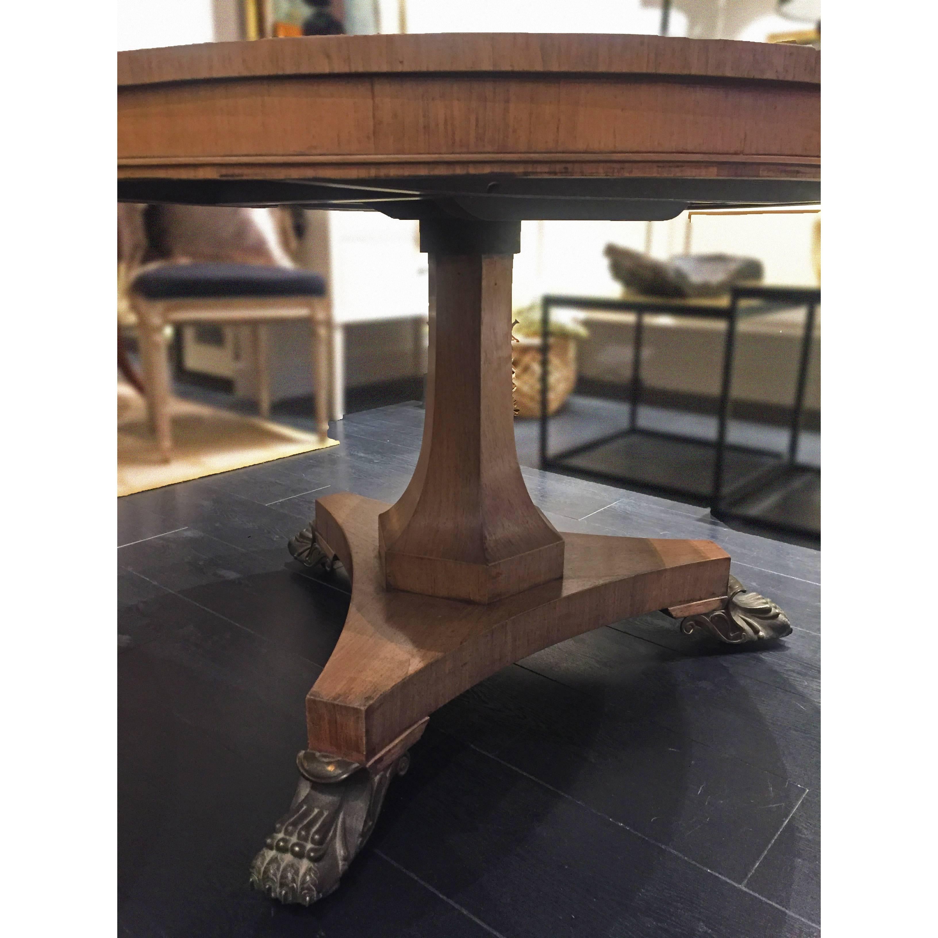 Beautifully crafted Swedish walnut table from 1910 with contrasting iron claw feet.

Good antique condition considering the age