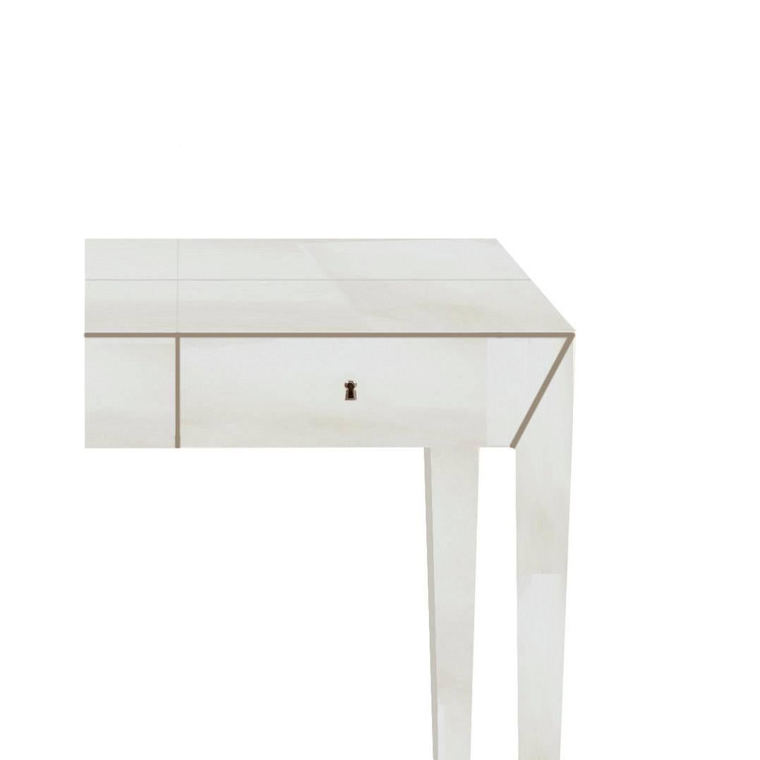 Vellum parchment desk with clear piano lacquer, brass lined drawers and nickel escutcheons. Bespoke dimensions and finishes available on request.

W143 x D75 x H77 cm 

Lead time: 6 - 8 weeks