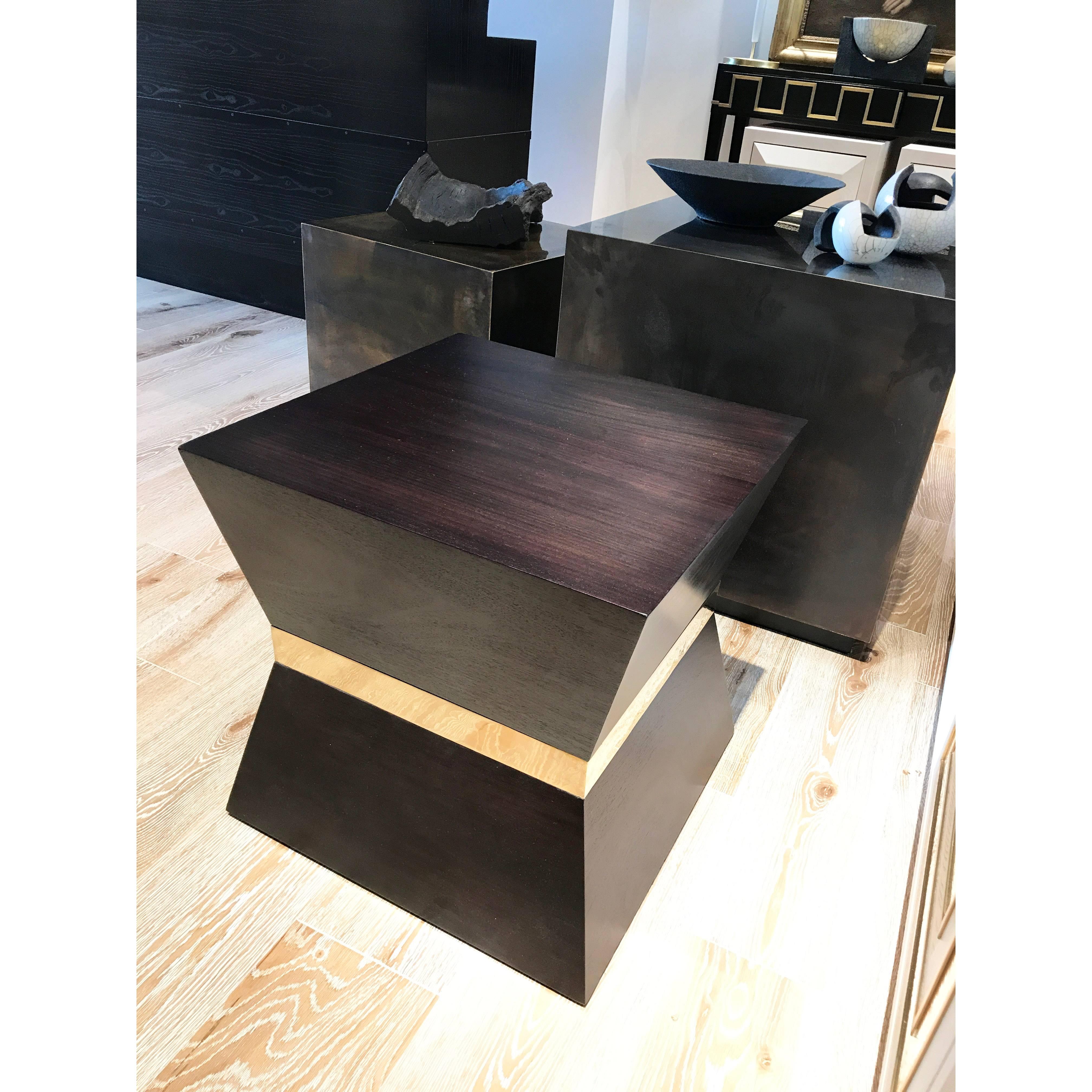 Tapered ash wood satin lacquered side table with brass trim around the middle. Available in black (RAL 9004) or chocolate satin lacquered finish.

W50 x D50 x H50 cm
