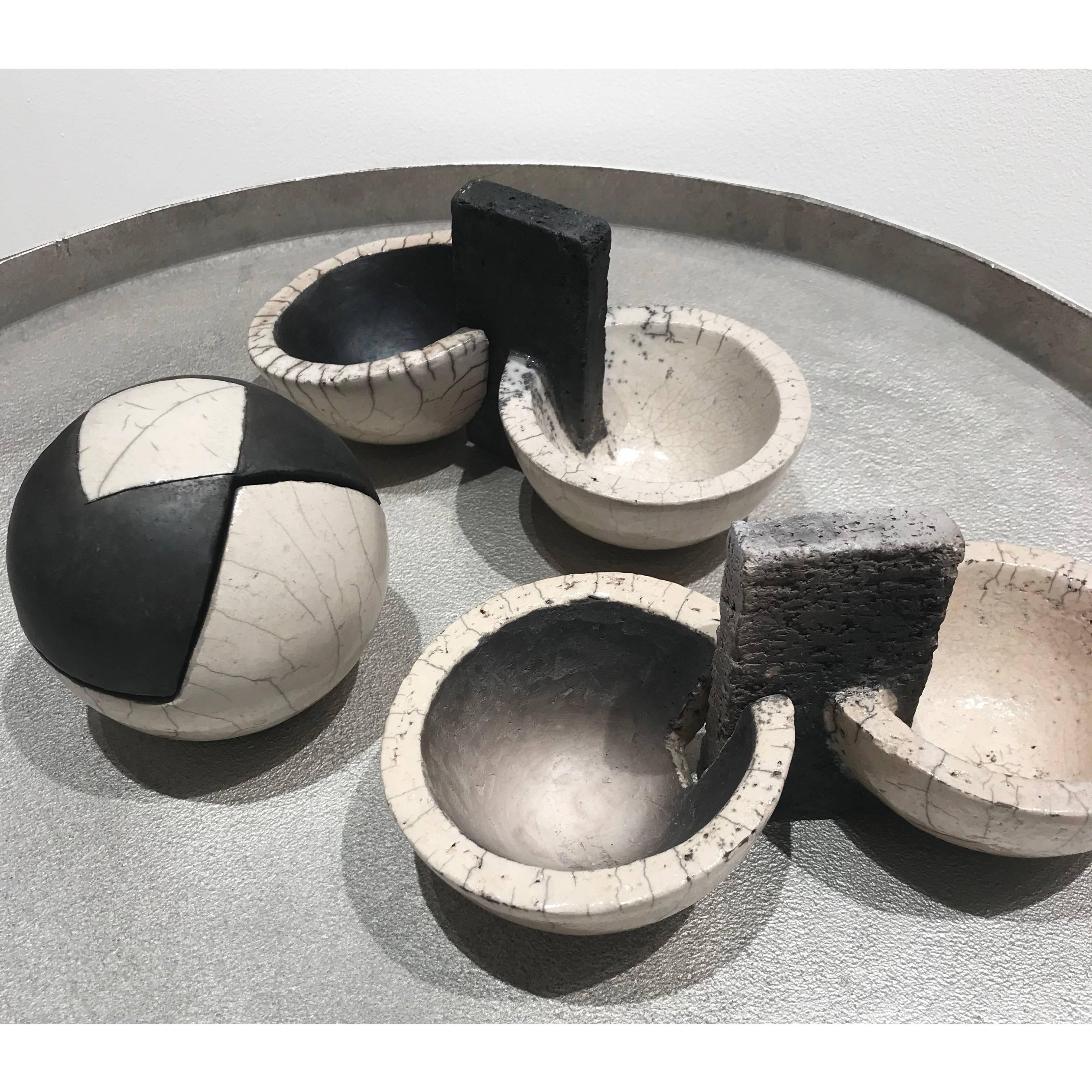 Ceramic objects which can be used as trinket boxes, coming in a range of different styles, shapes and sizes. Made in Germany. 

Bridge Bowl: W30 x D24.5 x H17.5 cm

Large Sphere: Dia15 x H15 cm

Small Sphere: Dia10 x H10 cm / W12 x D10 x H10