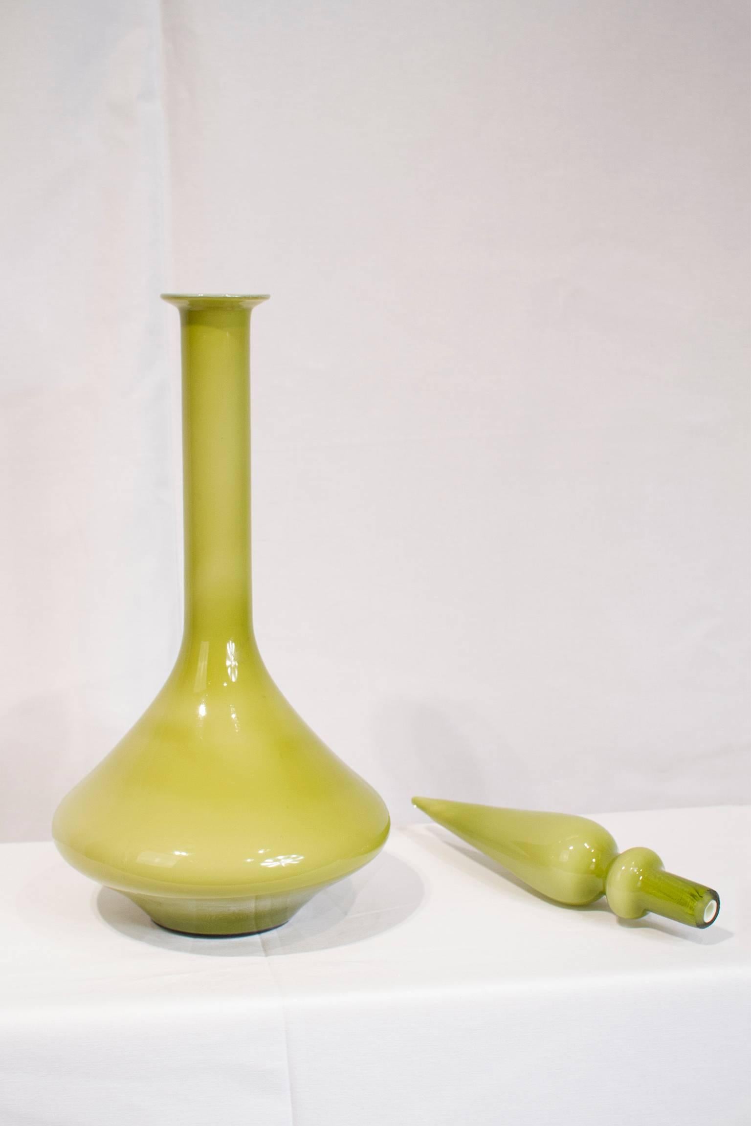 Italian Empoli art glass decanter with stopper from the mid-20th century. Excellent condition.

Please look at our storefront page to browse our entire collection.
Please contact us for delivery details.
 