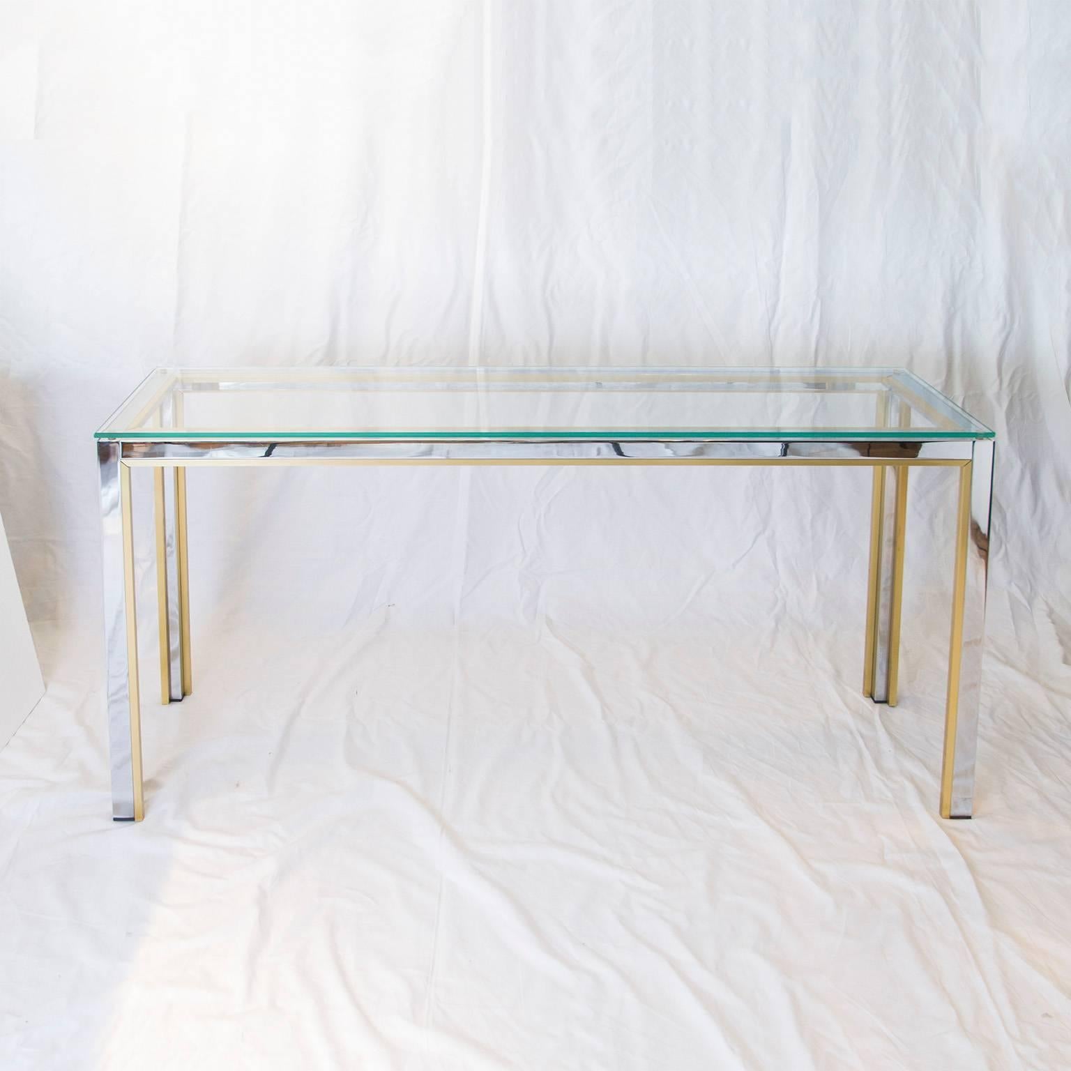 Beautiful console table in chrome and brass with a glass top by Romeo Rega, 1970s.

Please contact us for delivery details.