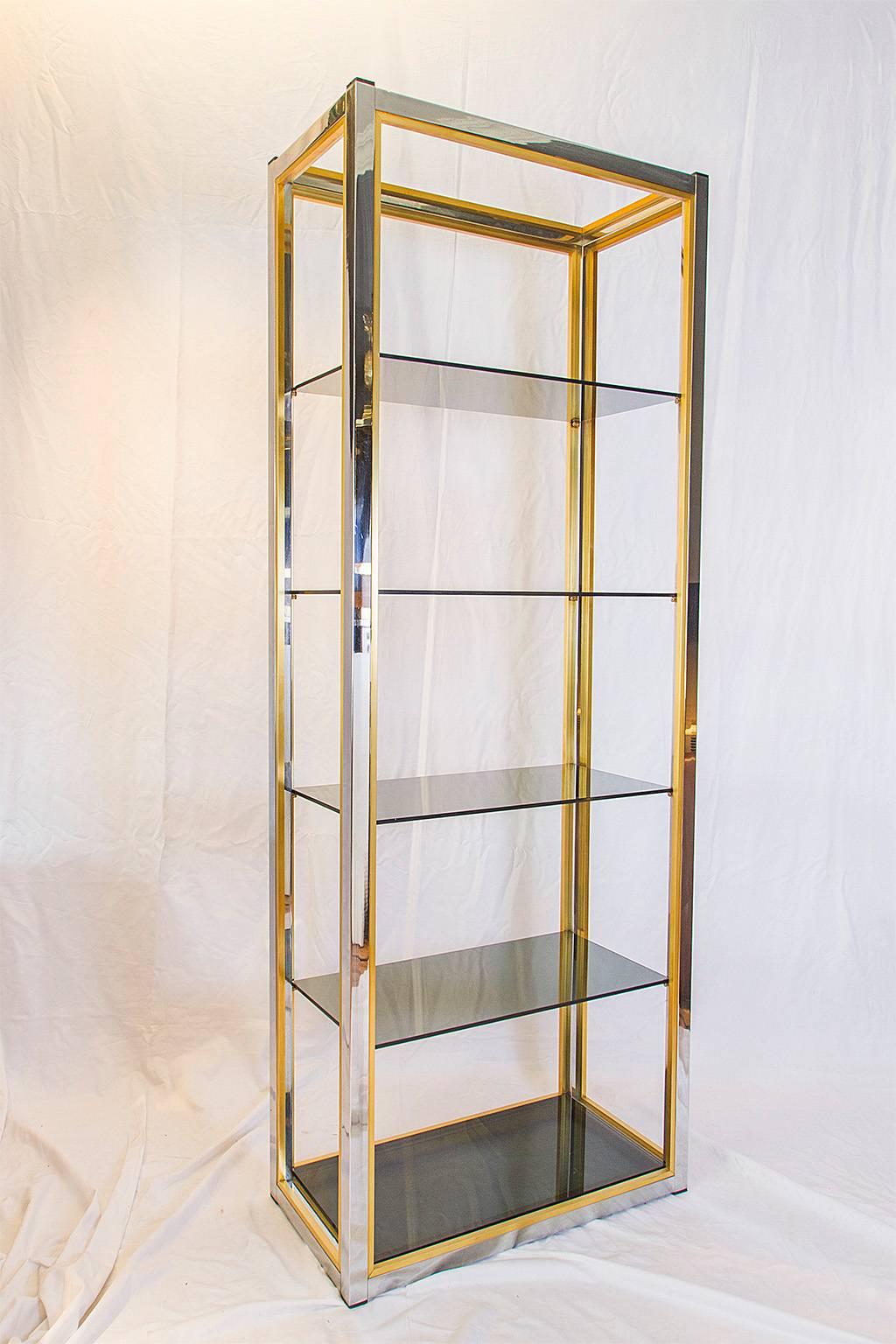 Beautiful and elegant etagère shelving unit with five glass shelves supported by a chrome and brass frame.

Please contact us for delivery details.