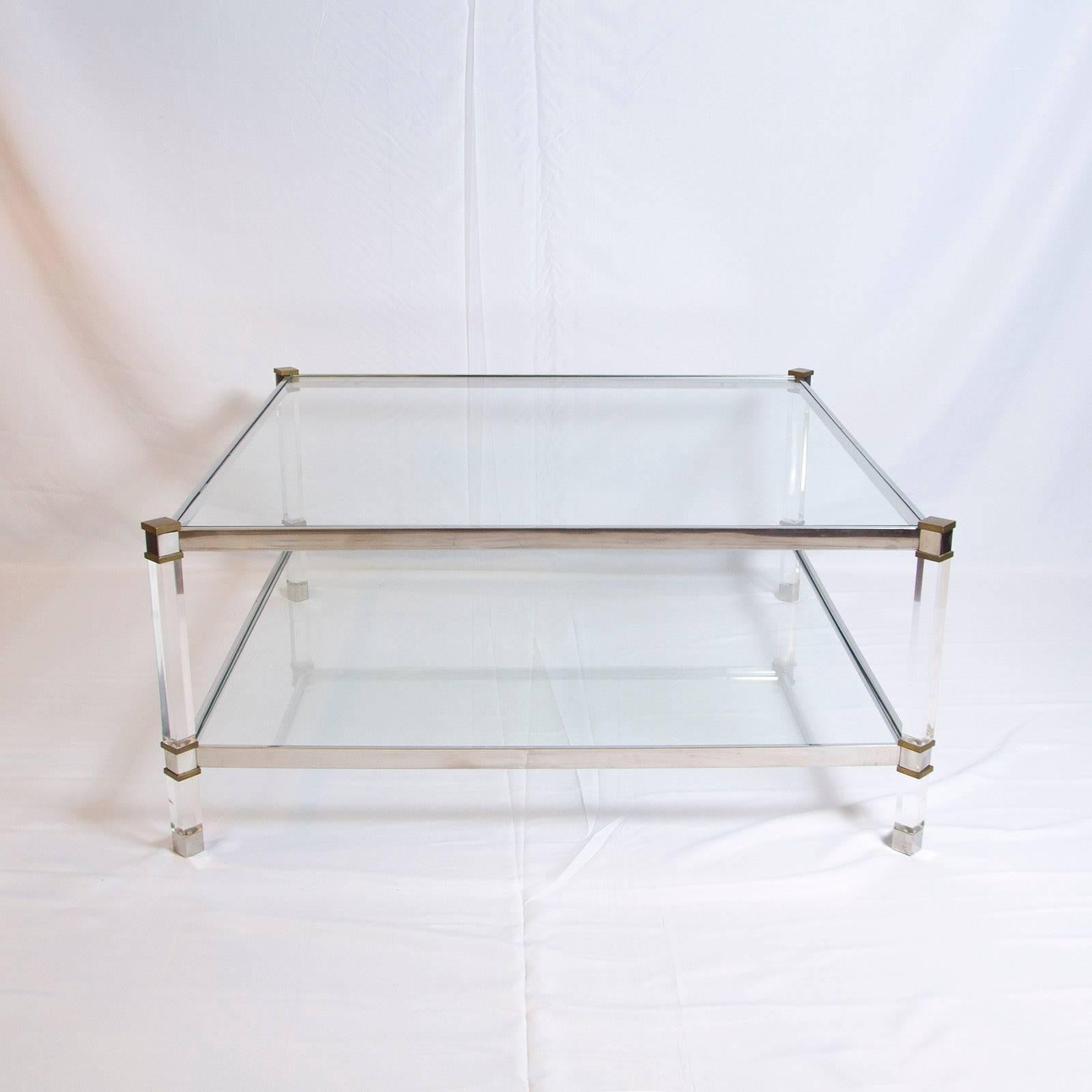 Beautiful two-tier Lucite, brass and aluminum coffee table.