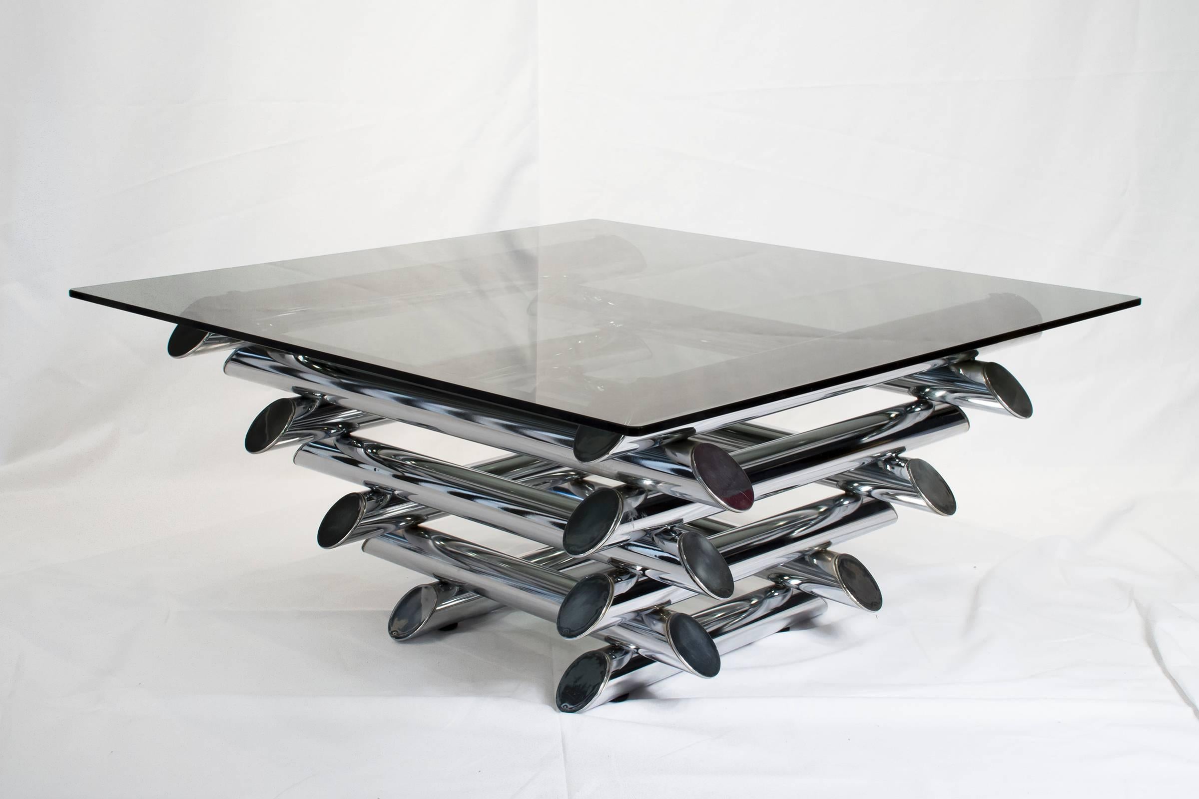 French Mid-Century Modern tubular chrome coffee table. Tiered metal coffee table with blue smoked glass top.

Please look at our storefront page to browse our entire collection.
Please contact us for delivery details.