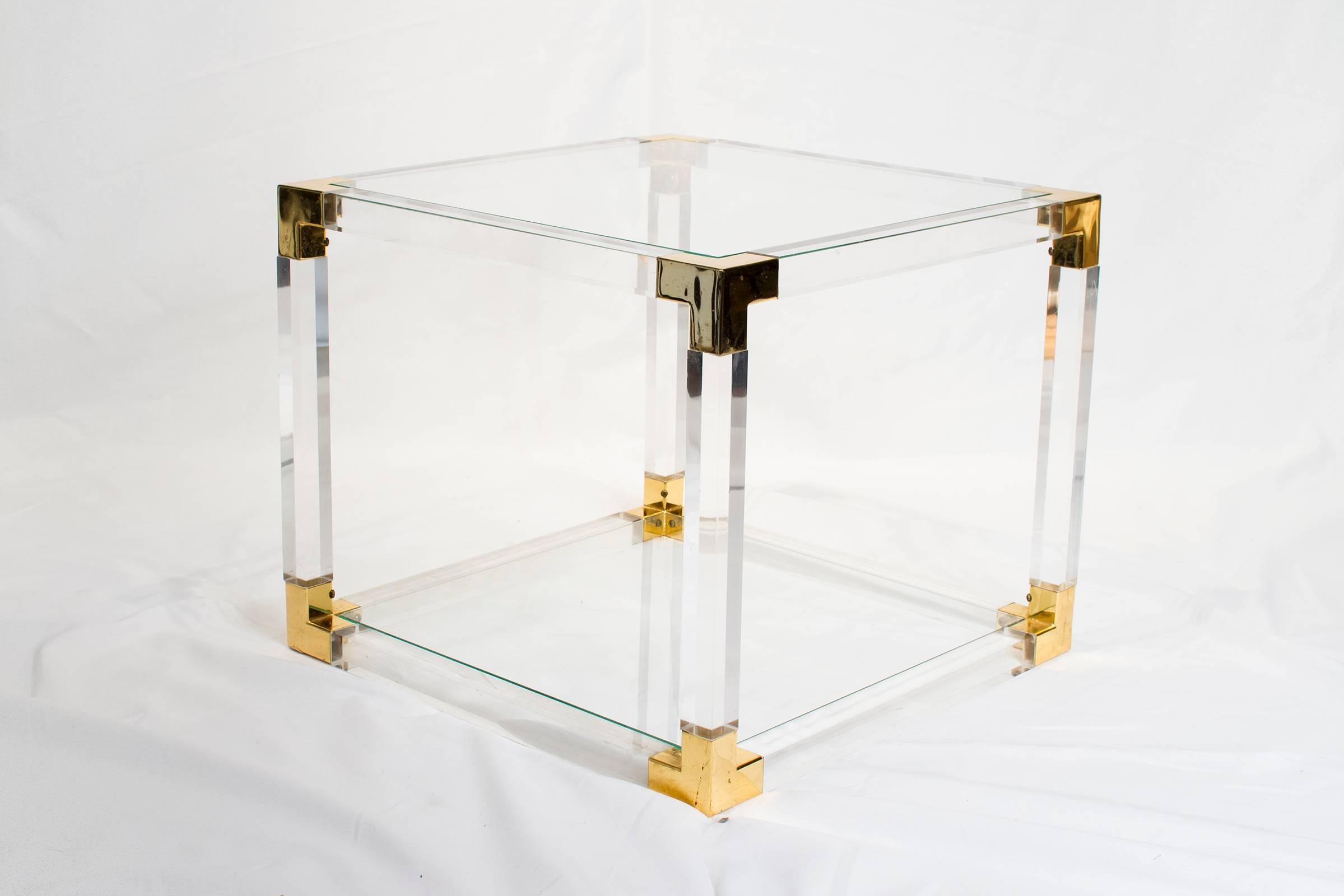 Elegant Lucite and brass side table with glass top in very good condition.

Please look at our storefront page to browse our entire collection.
Please contact us for delivery details.