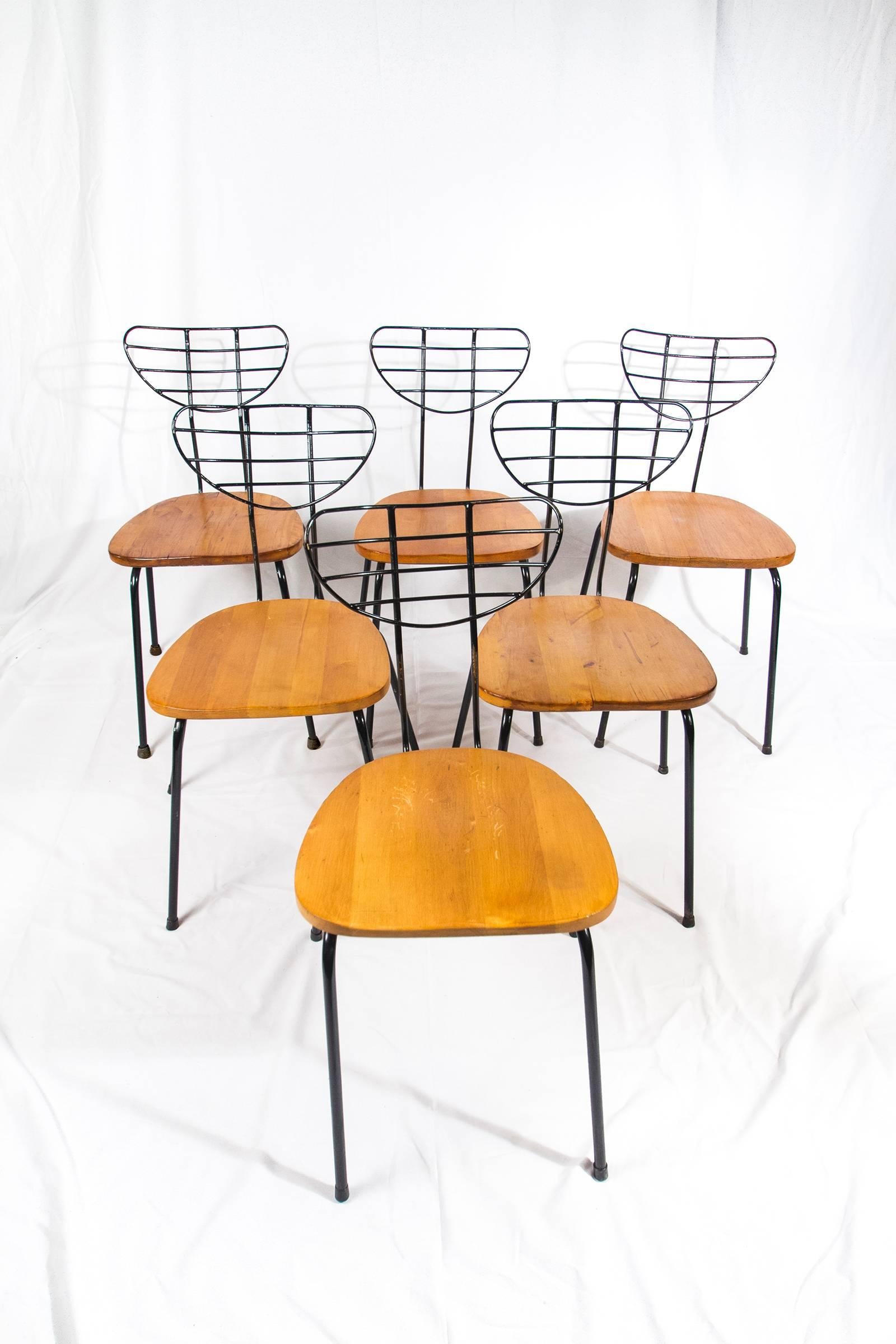 Set of six radar chairs by the Belgium designer Willy Van Der Meeren for Tubax, Belgium, 1950s.

Chairs made of a black painted metal structure with oiled wooden seats. The legs have black rubber receptions. 

Made circa 1955. 

The chairs are