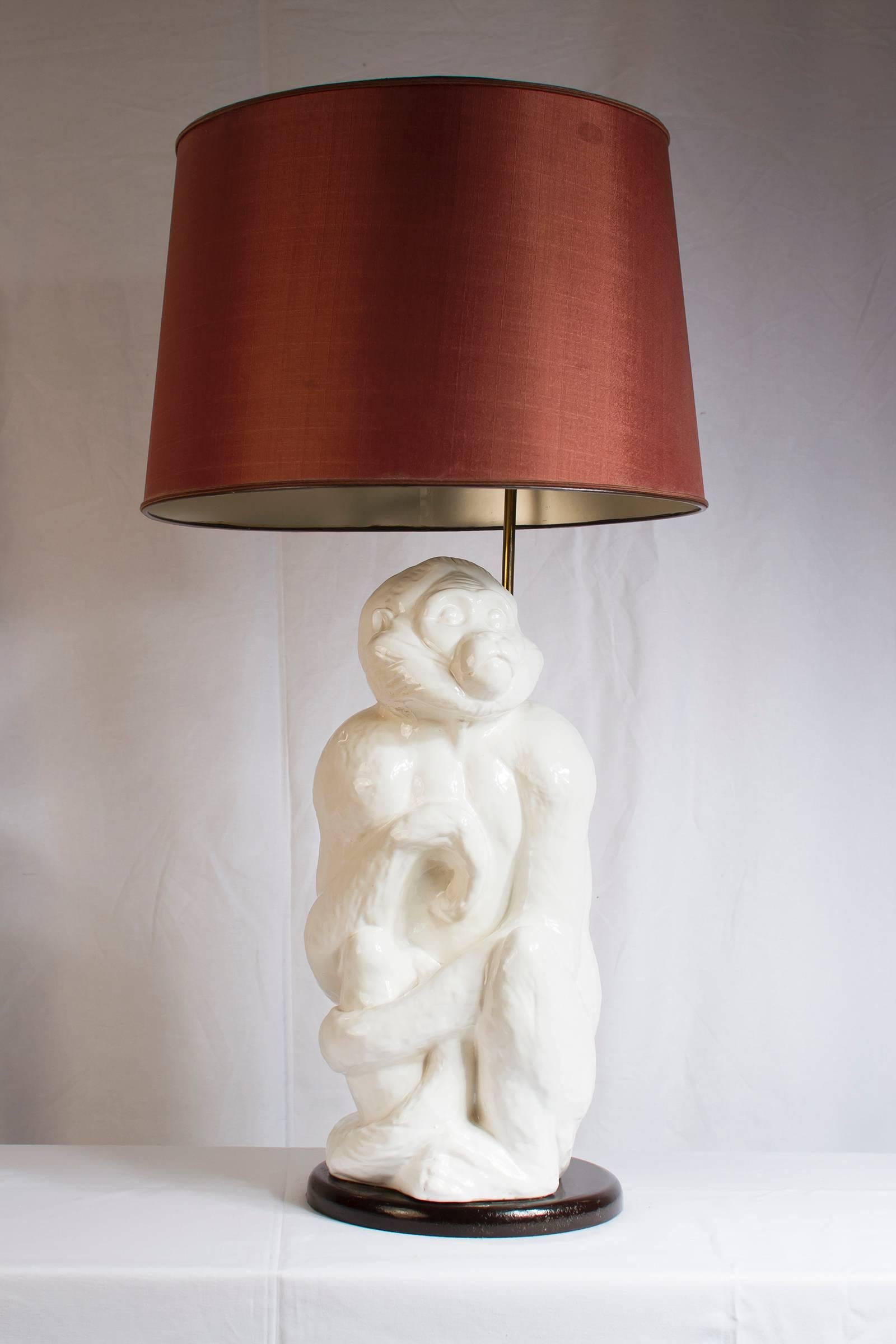Wonderful Italian white ceramic monkey lamp, Italy, circa 1950s. The foot of the lampshade is adjustable in height.

Please contact us for delivery details.
