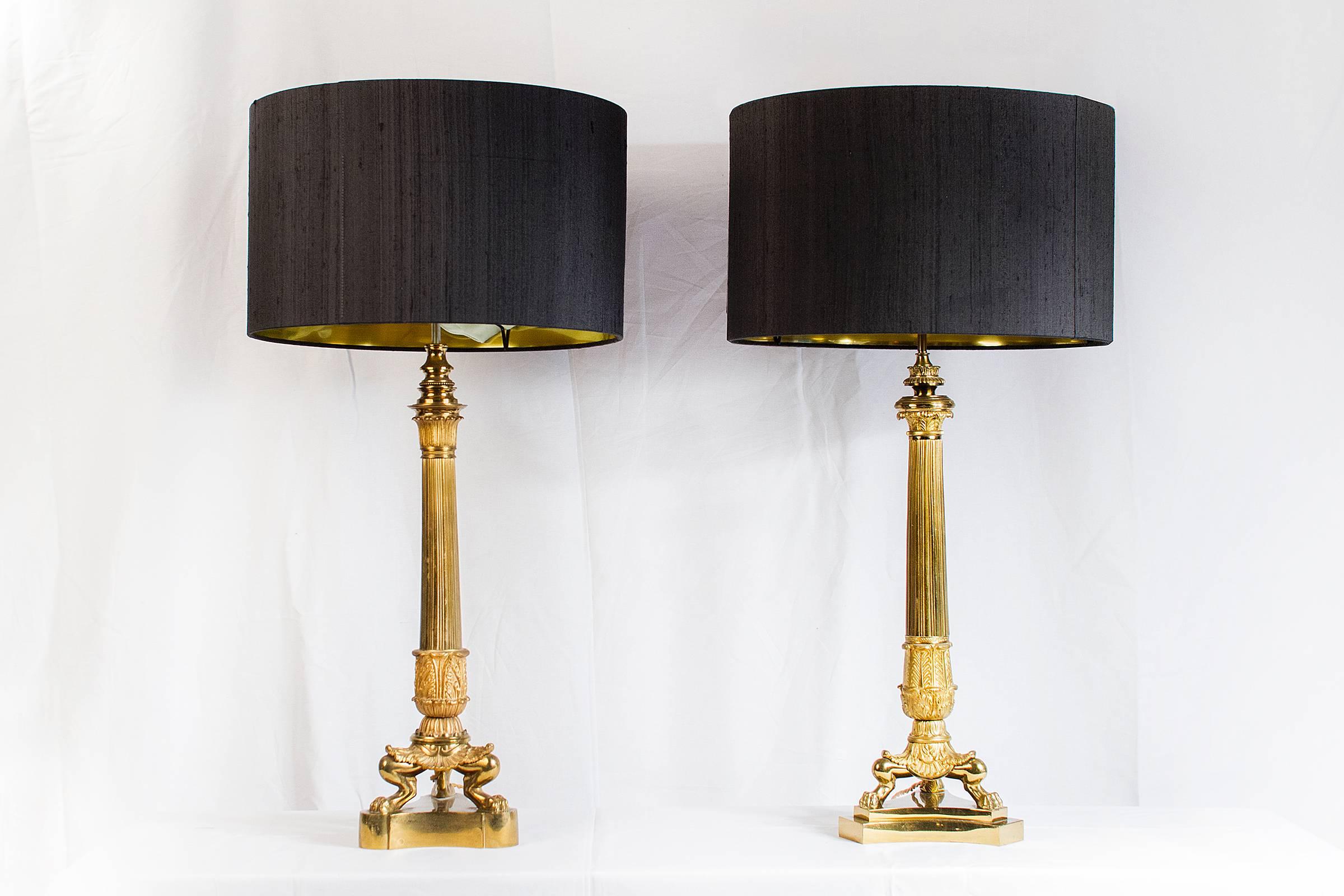 French Grand Ensemble of Empire Style Triple Lion Paw Gilded Table Lamps