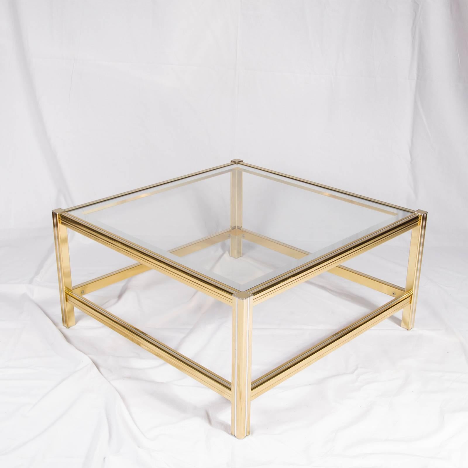 Magnificent end table, golden and silver metal with two glass shelves lined with mirror.

Please contact us for delivery details.