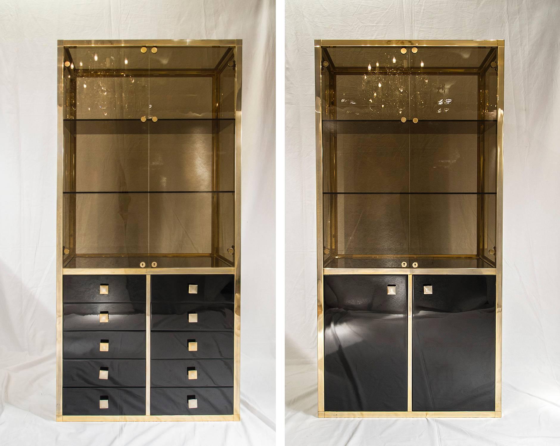 Beautiful and rare pair of 23-carat gold-plated vitrines, with black lacquered storage by to Belgochrome.

Please contact us for delivery details.