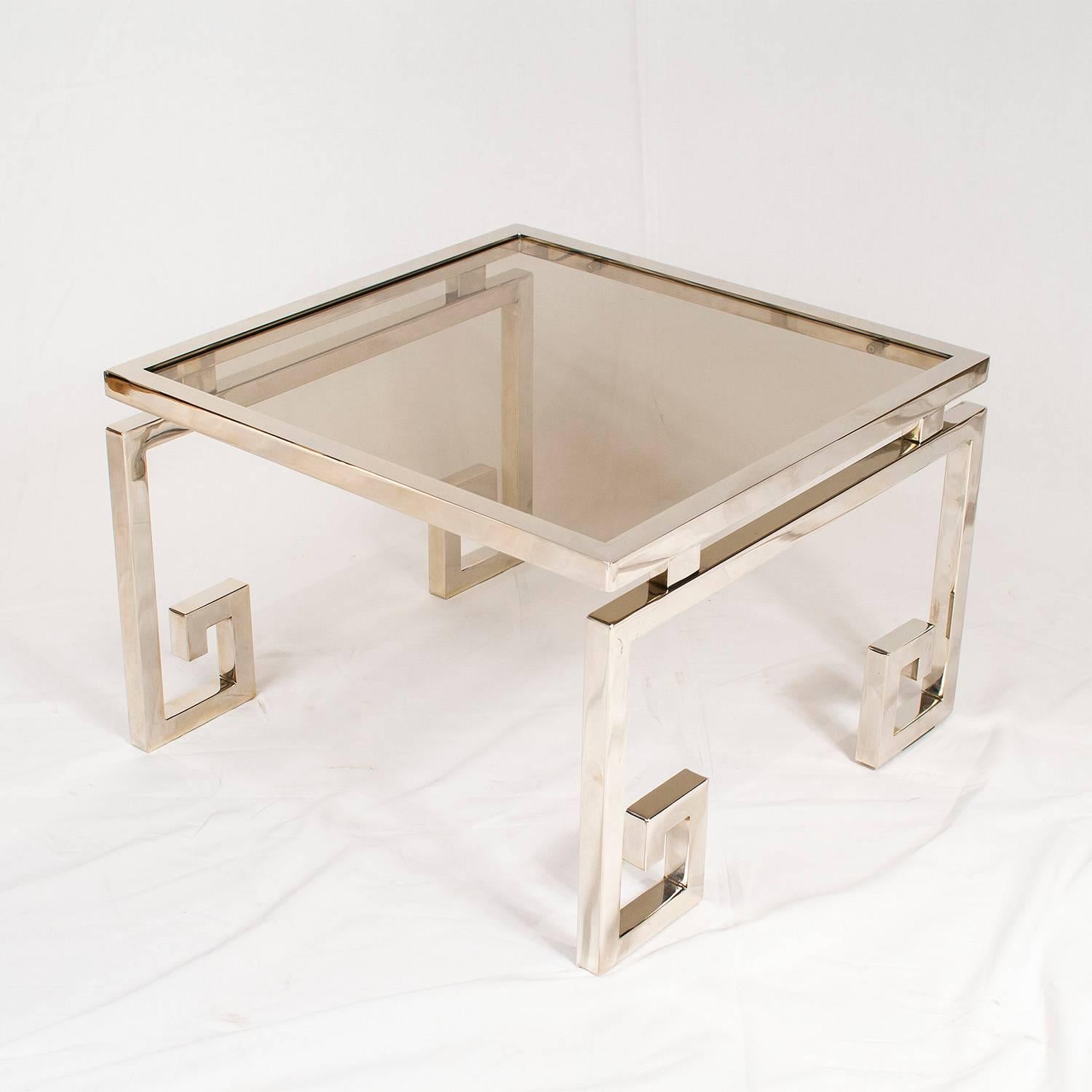 Chrome and smoked glass side table with Greek feet, 1970s.

Please contact us for delivery details.