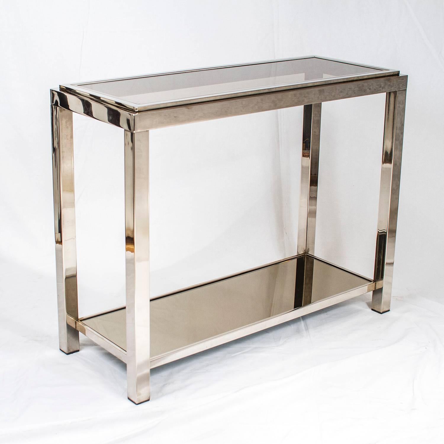 Chrome console table with smoked glass in the Style of Romeo Rega, in very good vintage condition. 

Please contact us for delivery details.