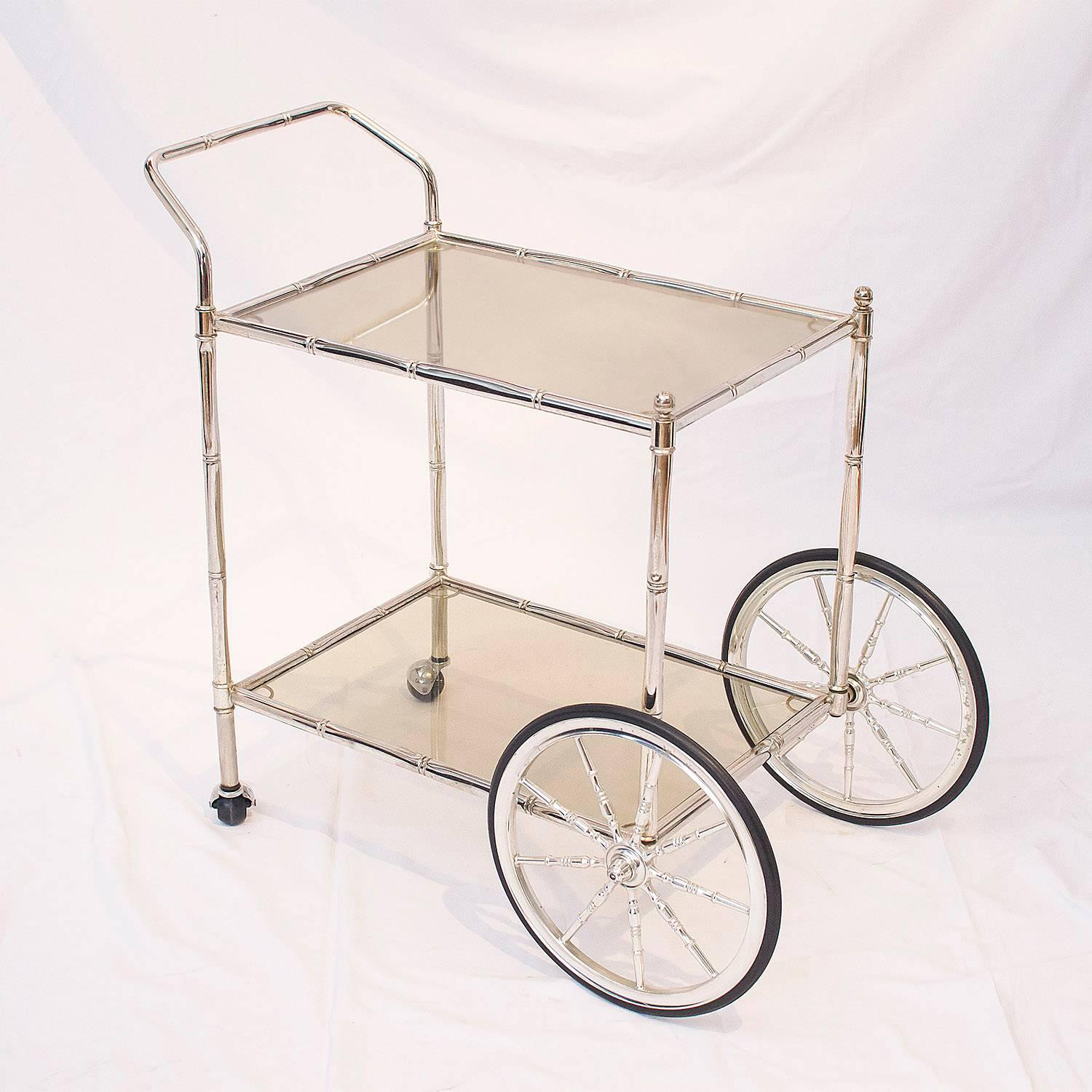 Faux bamboo chrome and glass bar cart, France, 1960s.

Please contact us for delivery details.