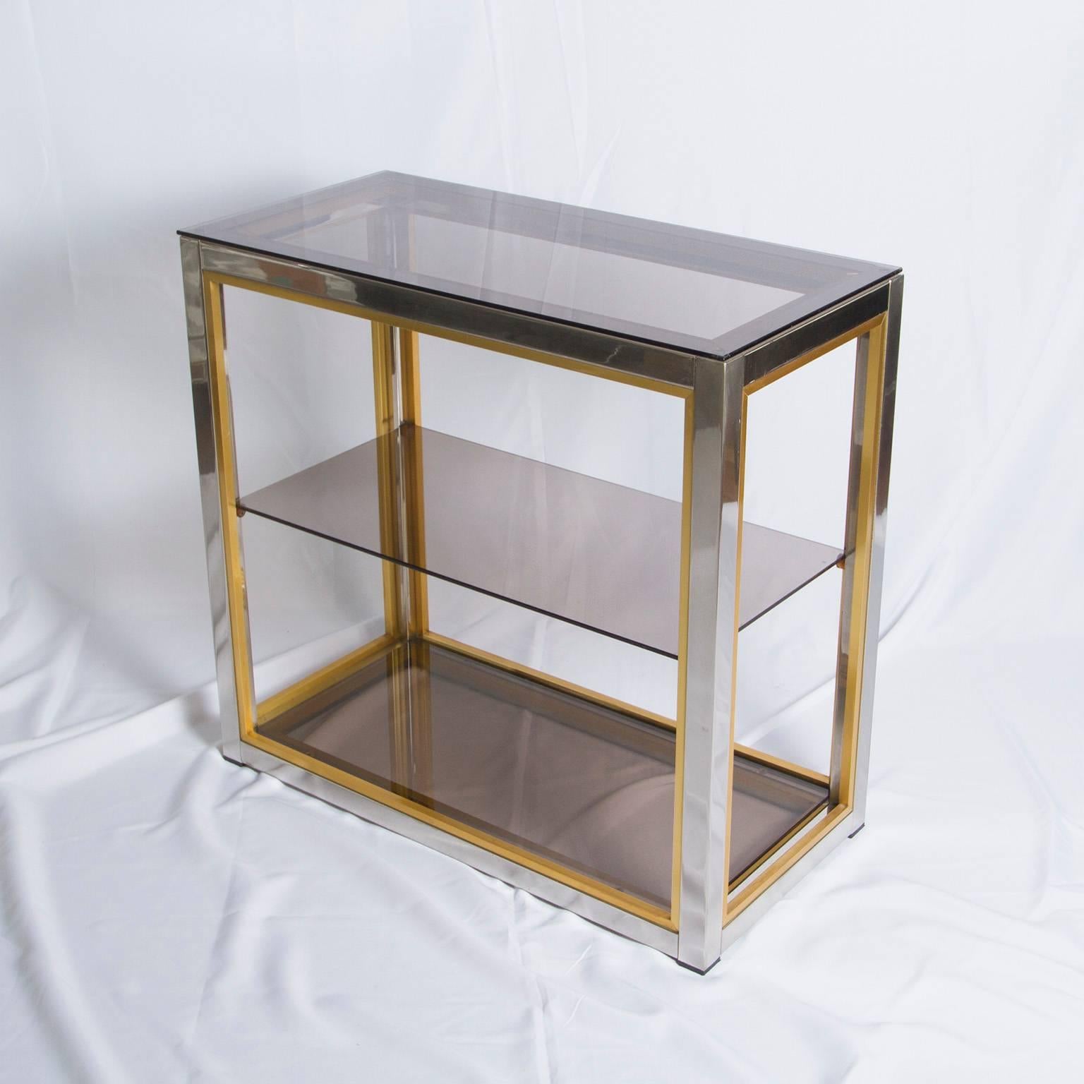 Beautiful three-tier console table in chrome and brass with a glass top by Romeo Rega, 1970s.

Please contact us for delivery details.