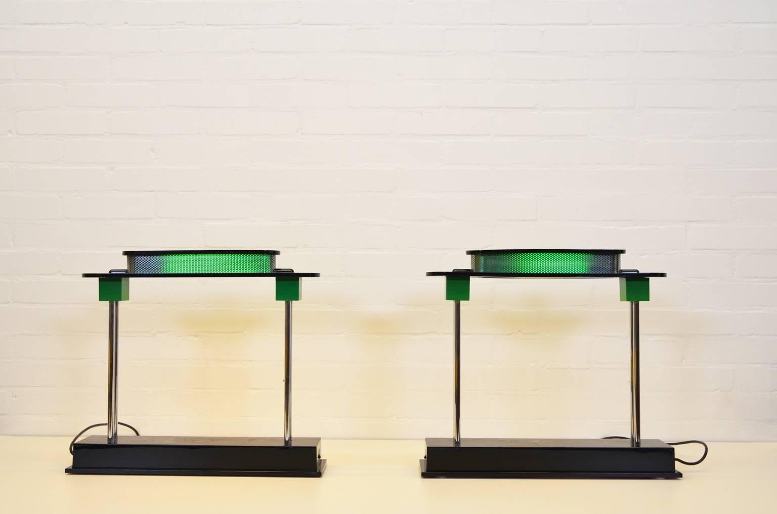 Architecturally designed lamp with classical as well as a modern elements by Ettore Sottsass, one of the founders of the Memphis Milano Group. The lamp is now re-issued, this set is from the original production period from the 1980s. Both lamps are