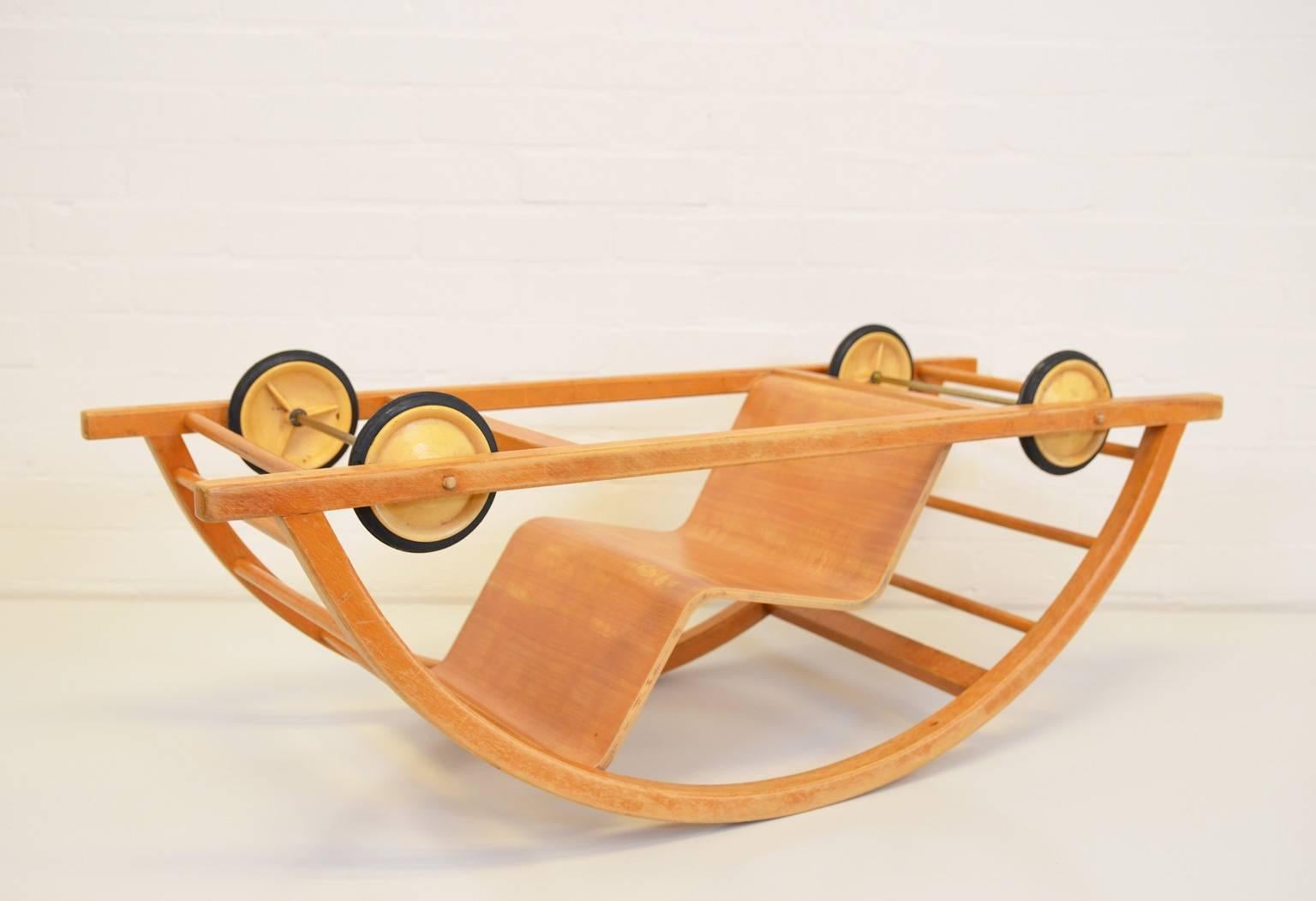 The Schaukelwagen can be used as a toy vehicle or as a rocking chair and is a design by students Hans Brockhage and Erwin Andrä. Both studied at the Academy of Fine Arts in Dresden. The swing car is designed under the supervision of Mart Stam who