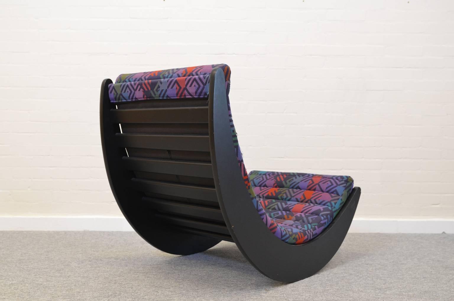 A good alternative for granny's rocking chair by Verner Panton The Relaxer two is extremely comfortable although getting out of the chair can be a challenge. The chair with the wooden black frame is in a very good condition with original upholstery.