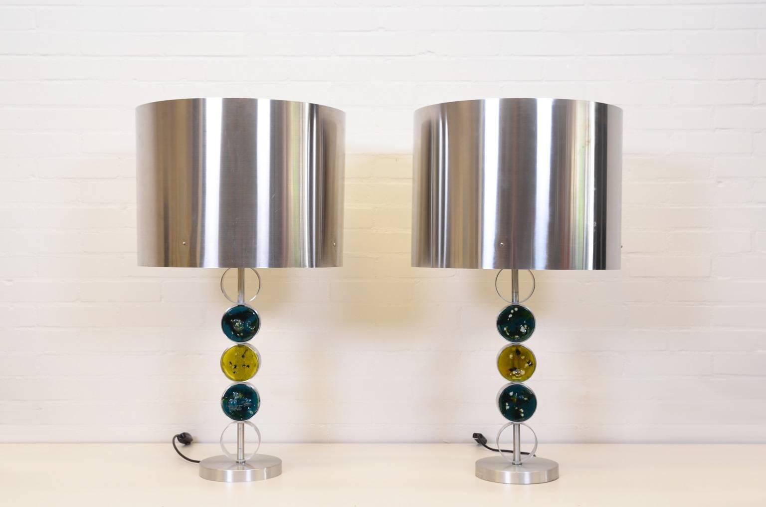 Rare table lamps from RAAK Amsterdam. The lamp is characterized by the very special design of the stand in which three unique glass objects are used. The glass objects can be moved around. Beautiful as a set of two but also sold individually.
