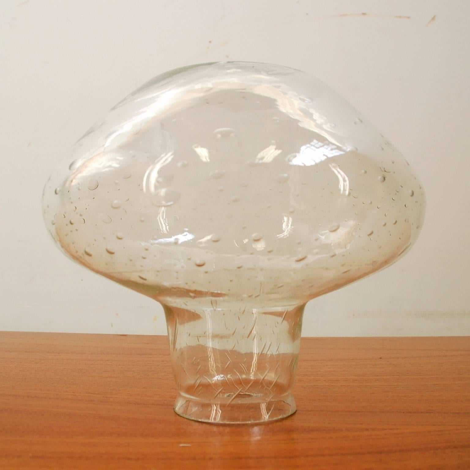 Wall lamp with beautiful glass sphere, black metal support and porcelain lamp socket. It was made by Louis Poulsen as type nr 38478 and remains in excellent condition; I don't think it has ever been used. This is not a very common lamp and