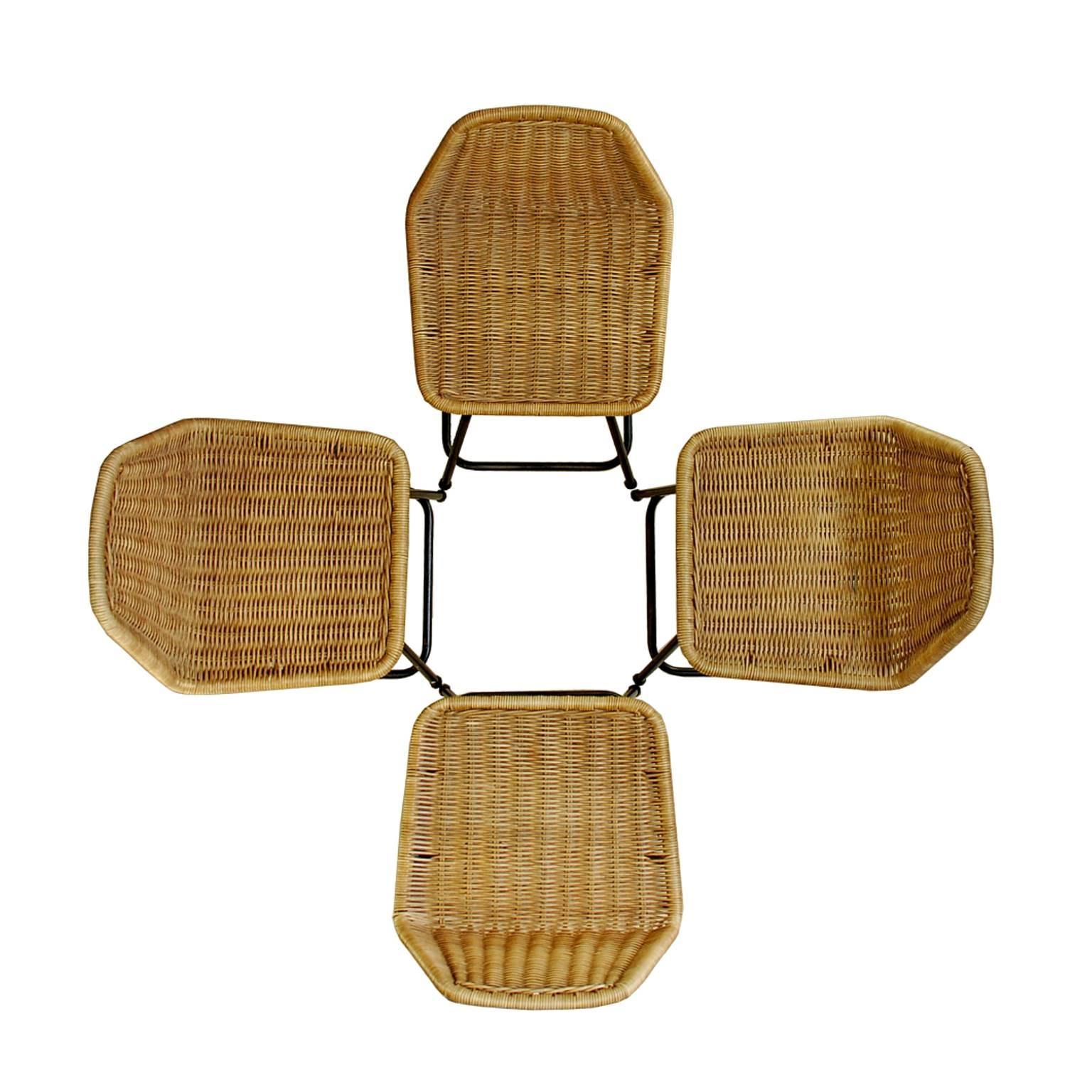 Set of four elegant stools with a black metal frame and wicker seats. They were designed in the 1960 by Dirk Van Sliedrecht and produced by Rohe Noordwolde. Please check the dimensions, these are small, chair-size stools.