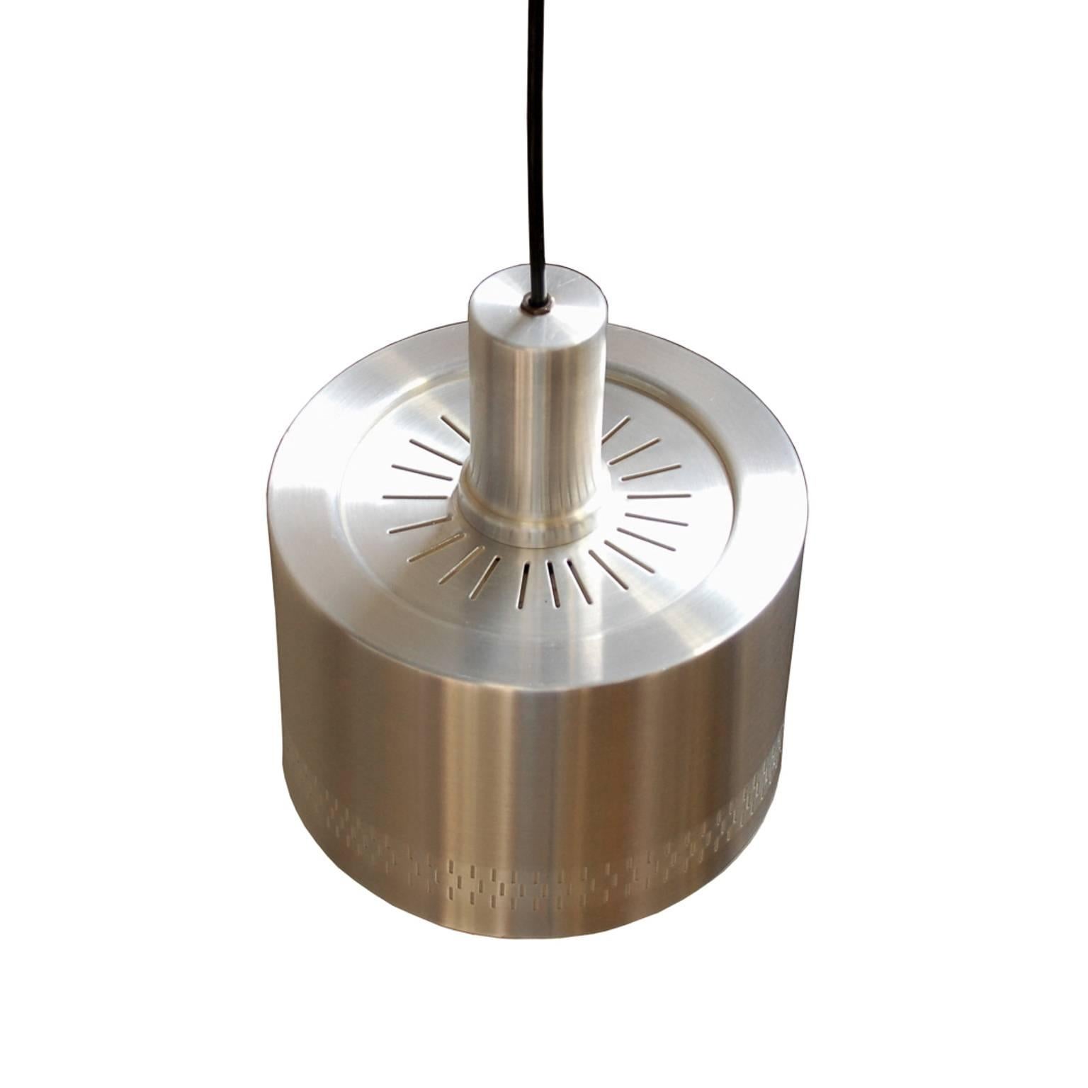 Simple yet elegant pendant lamp in brushed aluminium. The perforated rim makes for a nice detail.