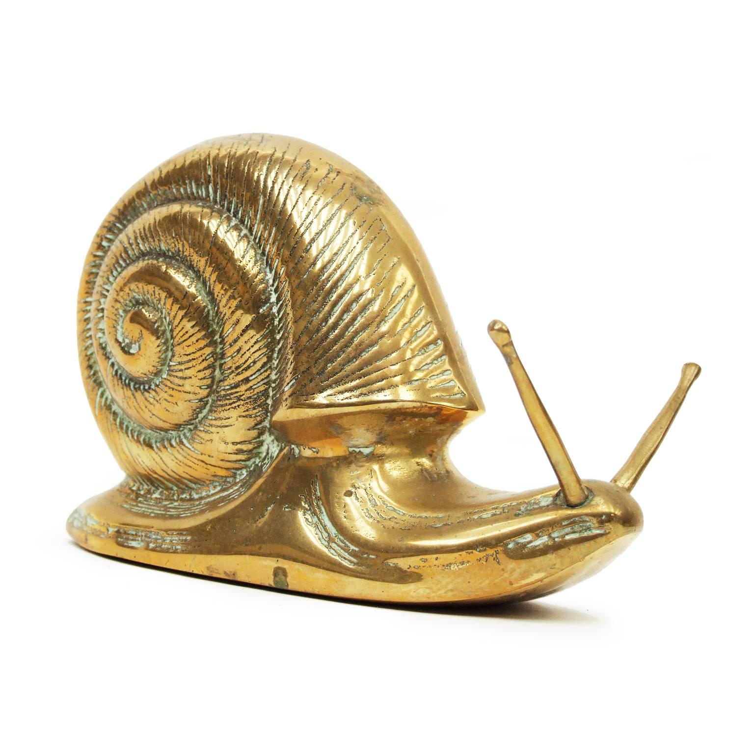 1950s large brass snail sculpture designed and manufactured in France.

Measures: H 12cm x L 20cm x W 10cm.