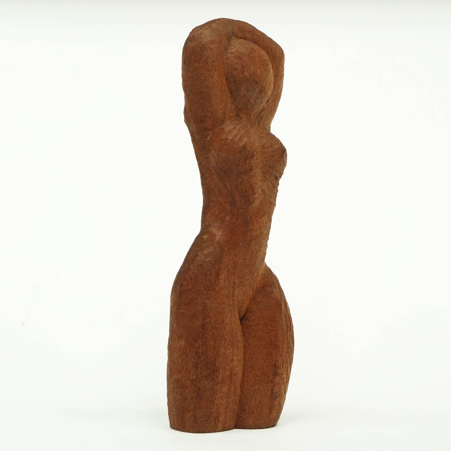 1960s hand-carved female nude sculpture in African teak.

Measures: H 44cm x W 16cm x D 9cm.