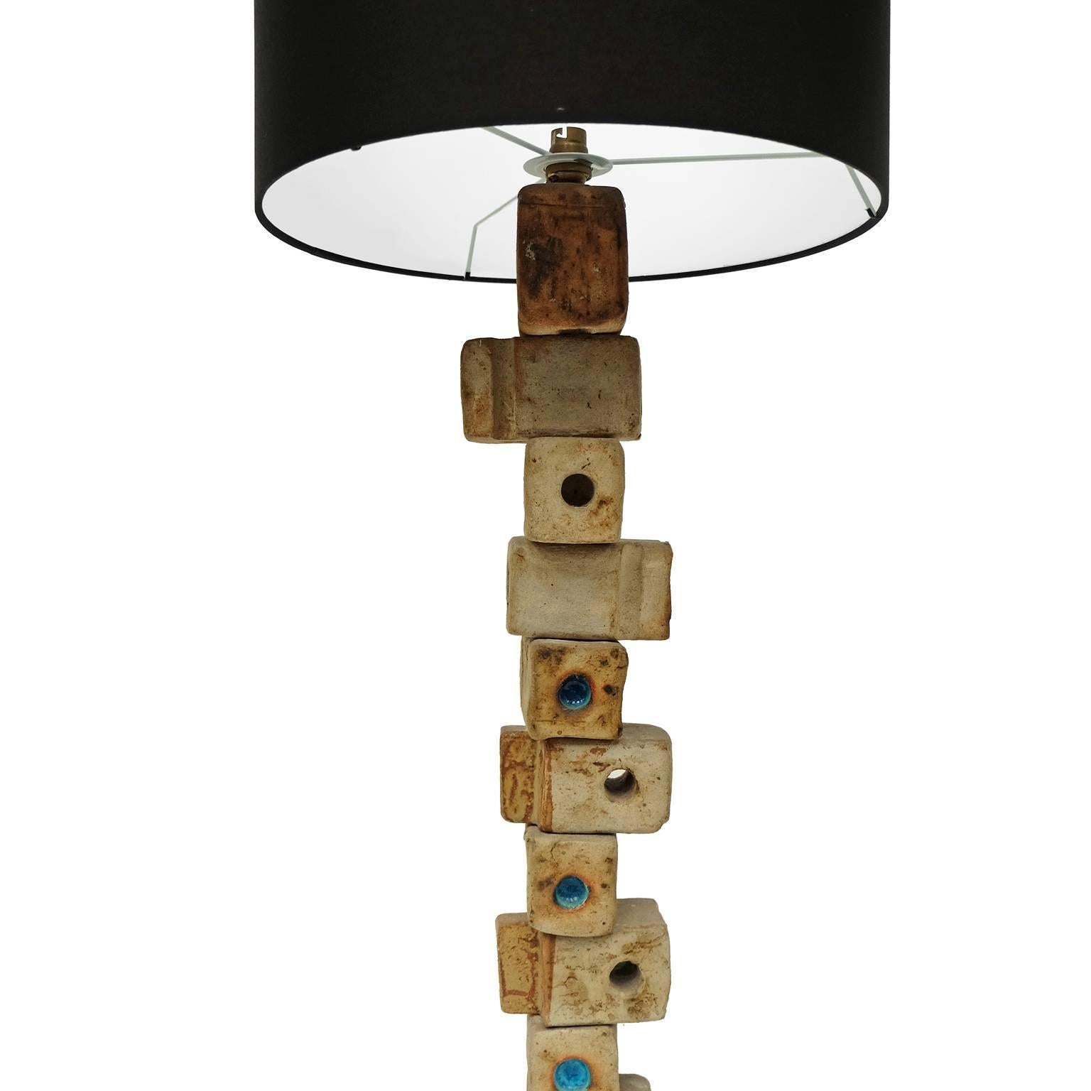 1960s TOTEM floor lamp designed and manufactured by Bernard Rooke, UK.

Stacked handmade ceramic block design with blue glazed detail.

Black cotton shade.

Measures: 
With shade: H 118cm x L 41cm x W 41cm.
Without shade: H 98cm x W 16cm x D