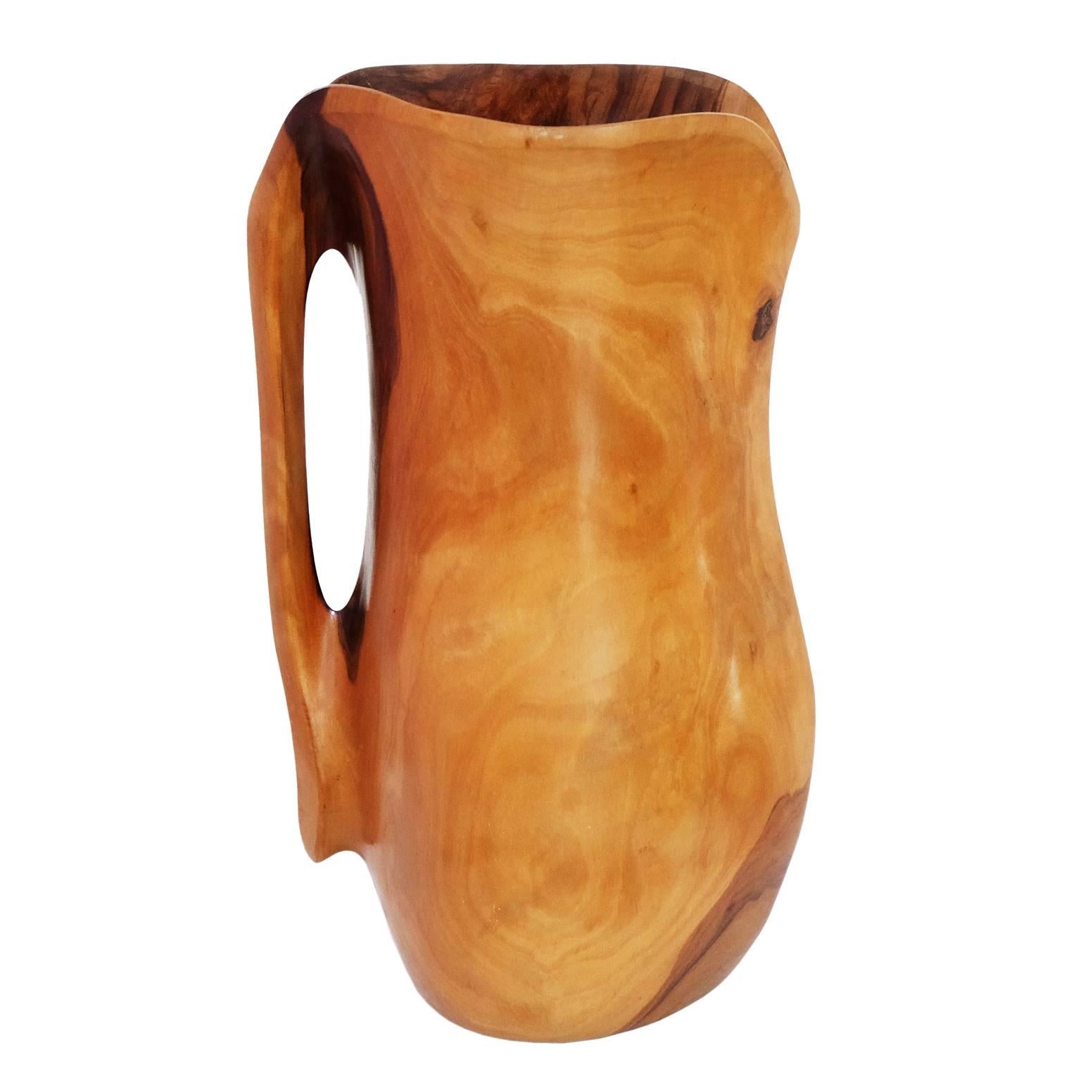 1950s hand sculptured olive wood pitcher attributed to French designer Alexandre Noll, France.

Measures: H 27 cm x W 16 cm x D 18 cm.
