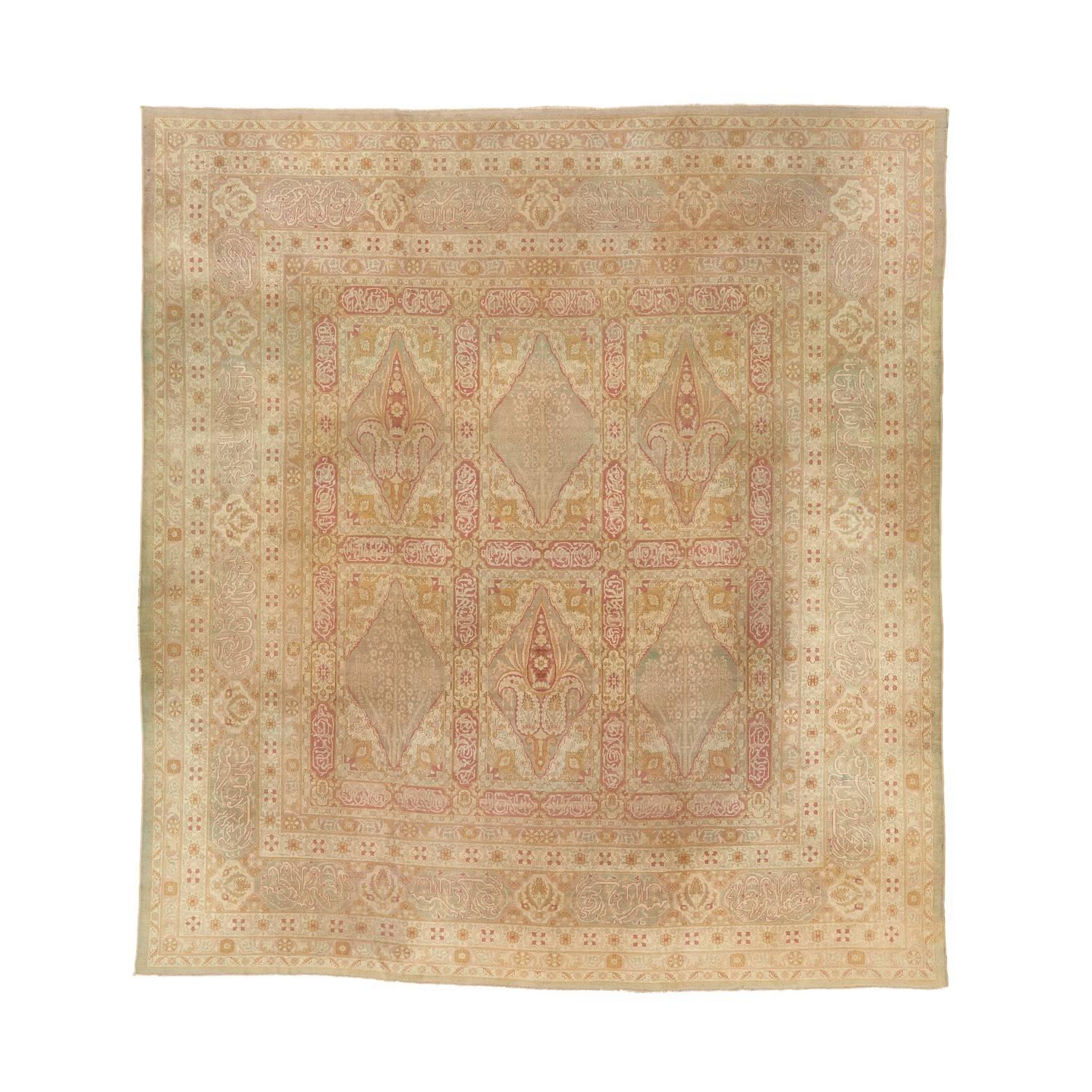 Handwoven in India, this antique Amritsar wool rug reflects the unique history that yielded the distinctive blend of Eastern and Western influences that characterized this weaving style. Inspired by the Persian 