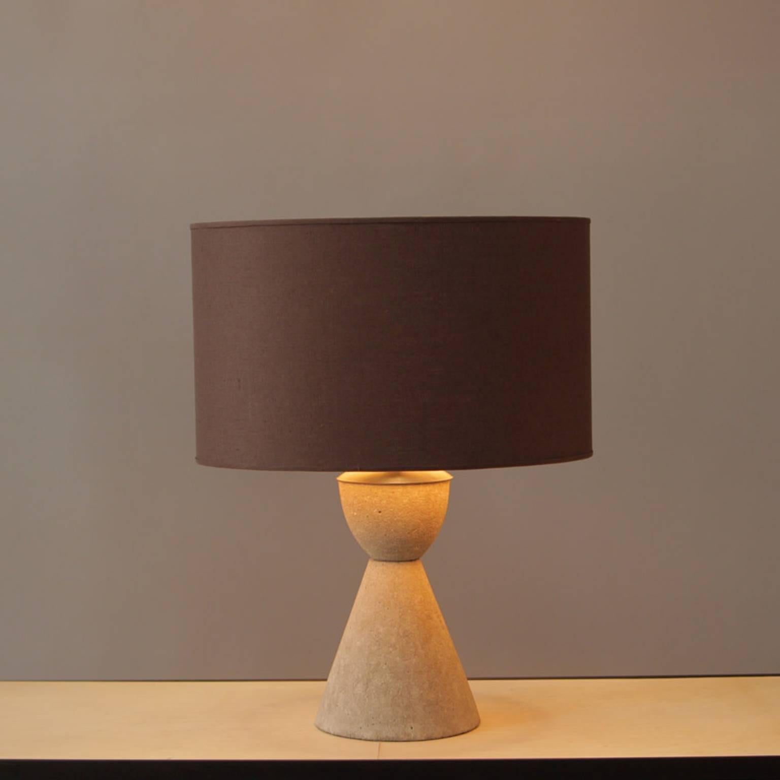 Concrete, steel base and cloth shade
by Joe Rugilio
Measures: 11” H x 8” W. Base shown with custom lampshade
Custom lampshade included
Additional custom sizes and finishes available upon request
Made in New York City by trans-LUXE