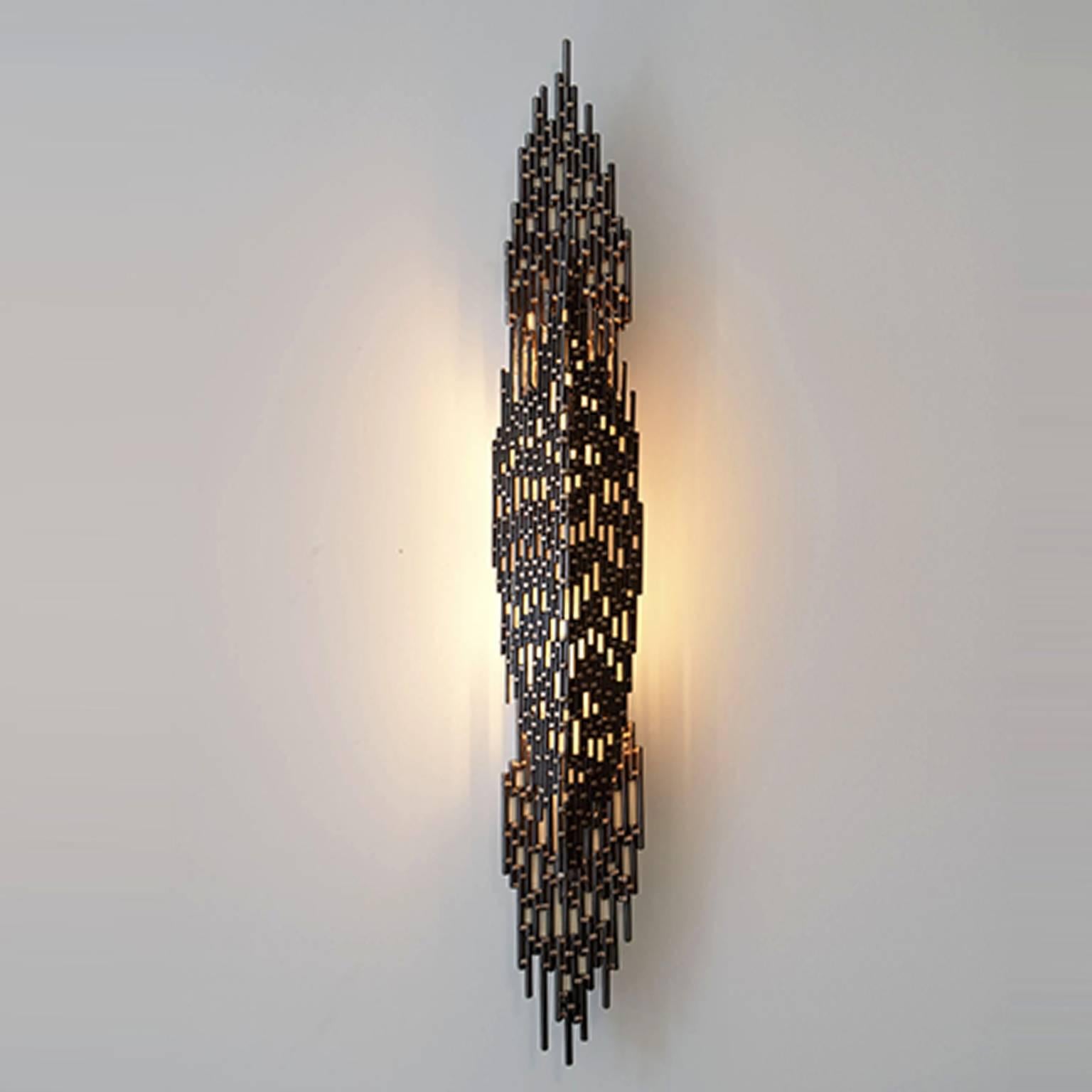 Dark bronze mesh metal sconce

In collaboration with Irma Teran

Crafted at trans-LUXE

The sconce consist of three parts of 23" H x 7" W each

Total height is 35"

The top and bottom parts are attached to the electrical