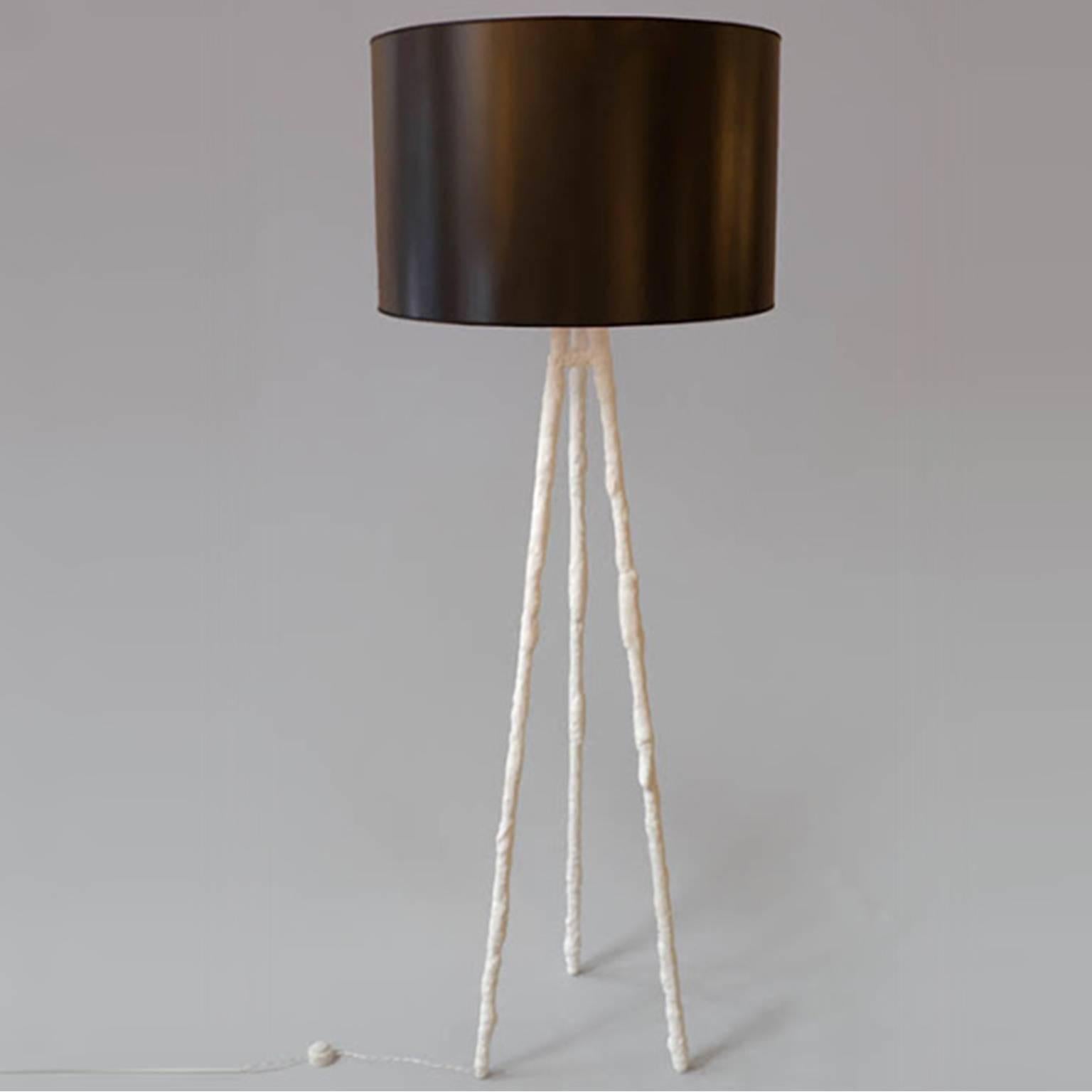 Triplico floor lamp.

Shade included by trans-LUXE.

Shade size: 26"D x 16" H.

Handmade plaster solid firm coated finish.

Measures: 58” H.

Made in New York City by trans-LUXE.

Additional custom sizes, colors and finishes