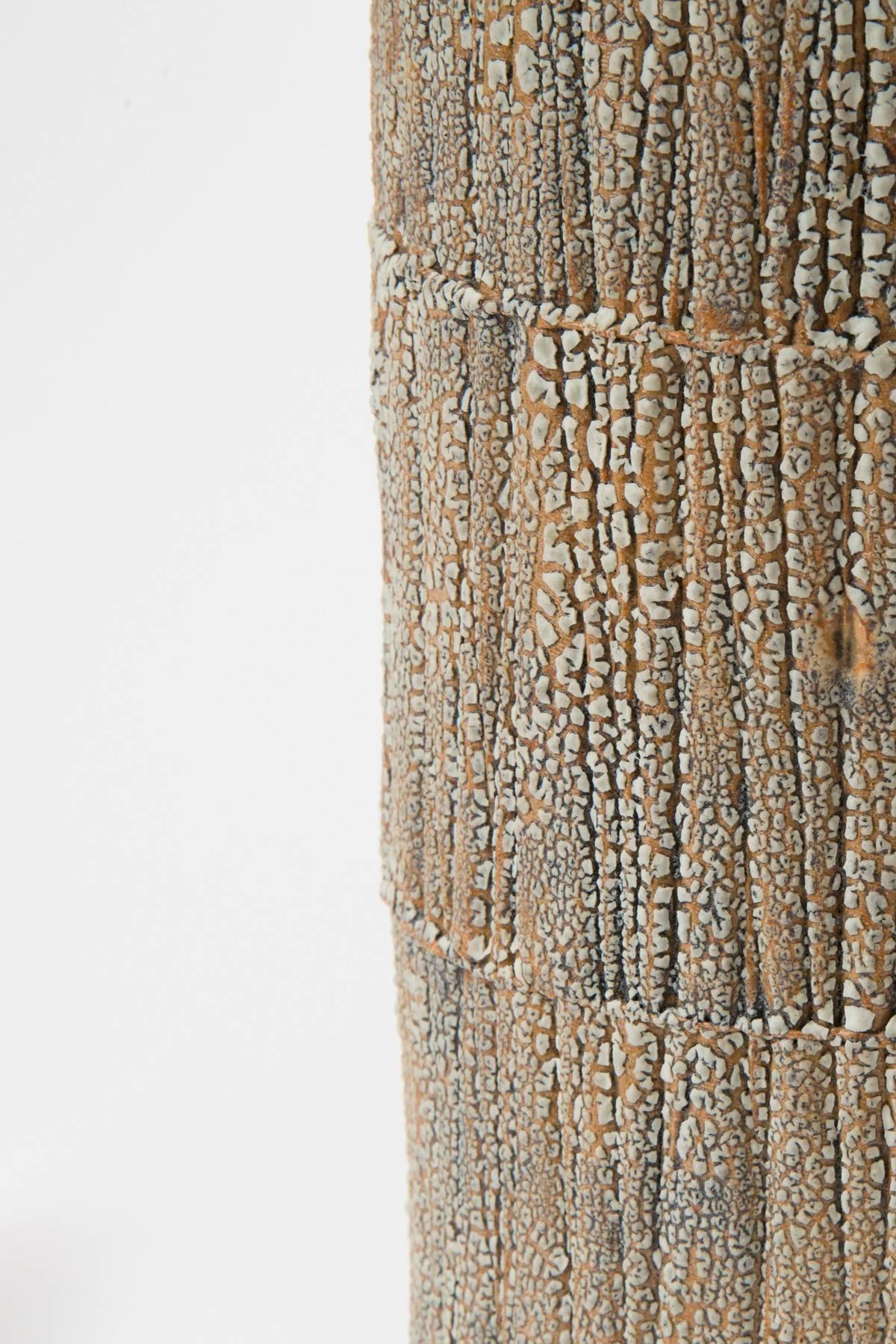 Shagreen textured ceramic table lamp with brass fittings.

The shade is velum paper 13 D x 12 H.

Handmade in NYC by Gary Dipasquale for Trans-LUXE.