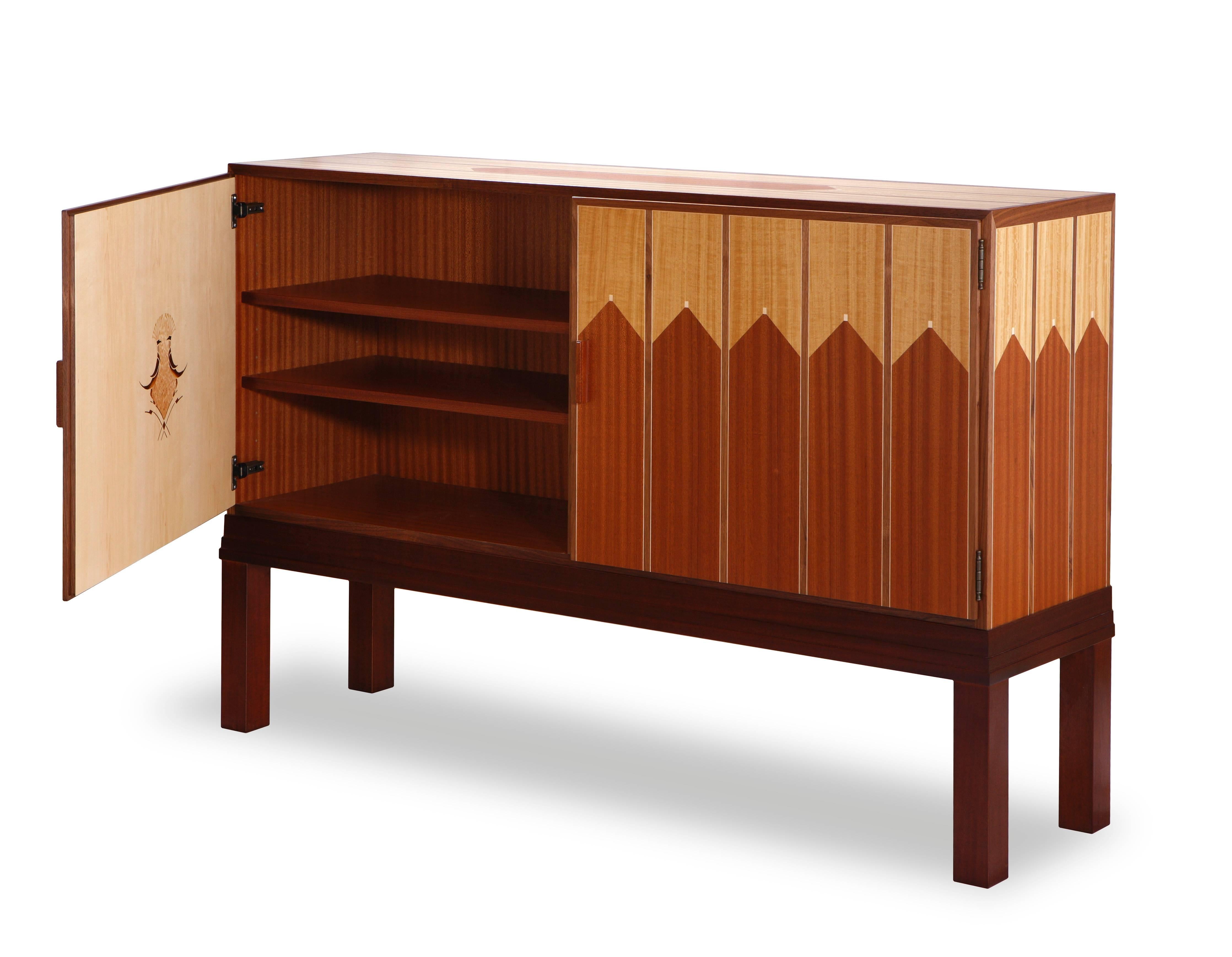 The Saarinen house credenza is part of Saarinen suite that represents one design of various suites of living room furniture in Saarinen’s Cranbrook home. The inlaid ornamentation with rhythmic pattern and the suite’s restrained elegance are unique