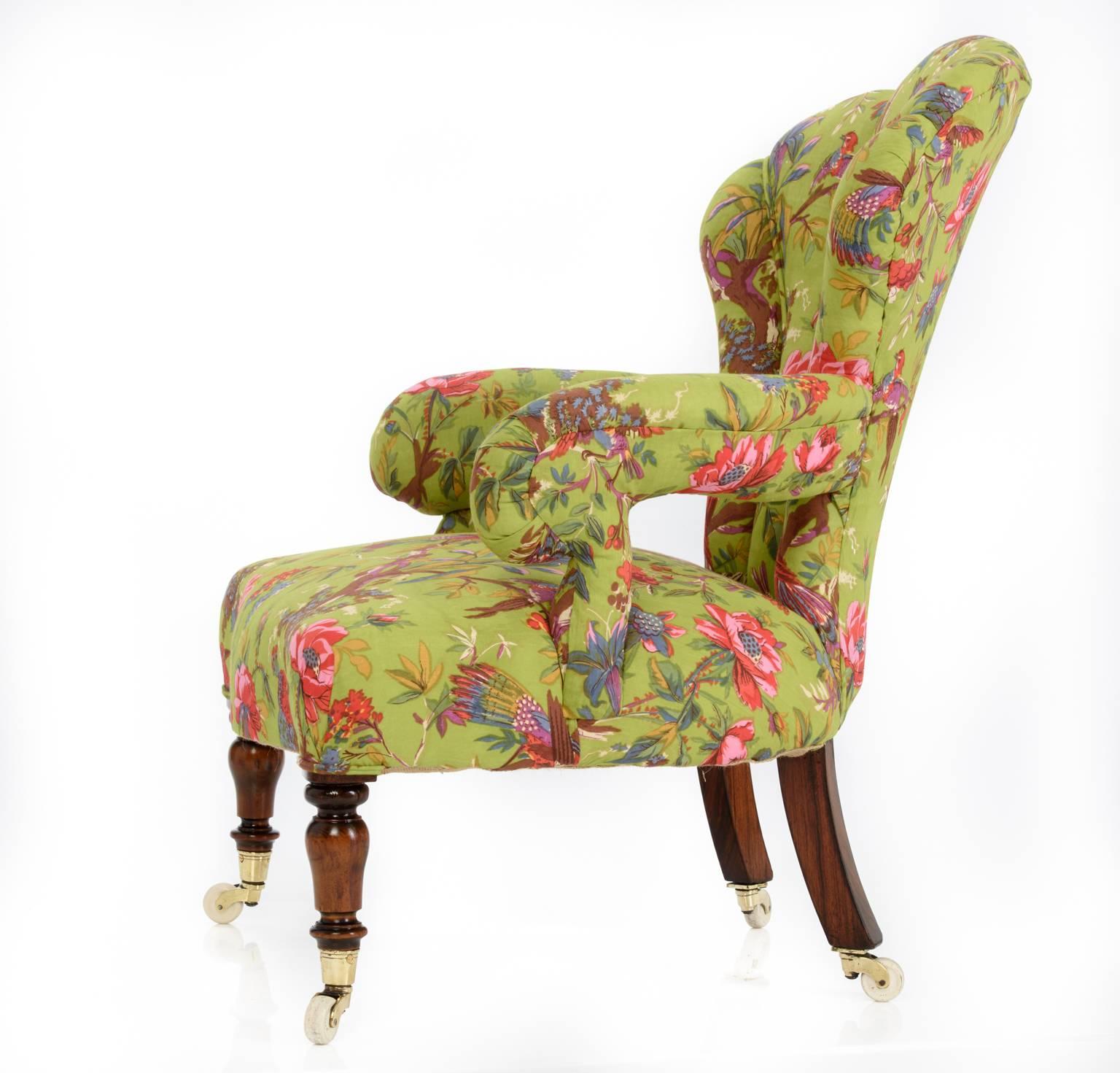 Simply stunning and unusual French iron framed, fan backed armchair, traditionally restored and reupholstered in a delicate hand blocked vivid lime parrot cotton, piped detail to front of legs, hand-sewn panel detail.

Resting on original turned