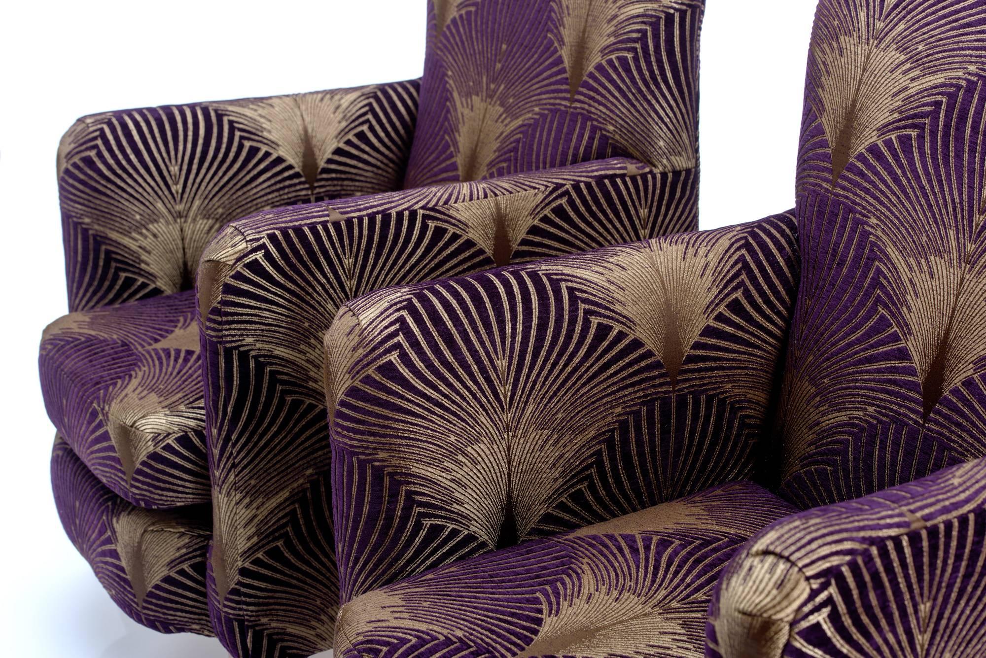 Delightful pair of unusual English Art Deco style armchairs reupholstered in gorgeous aubergine gilded fan fabric.

Resting on original restored square oak legs. 