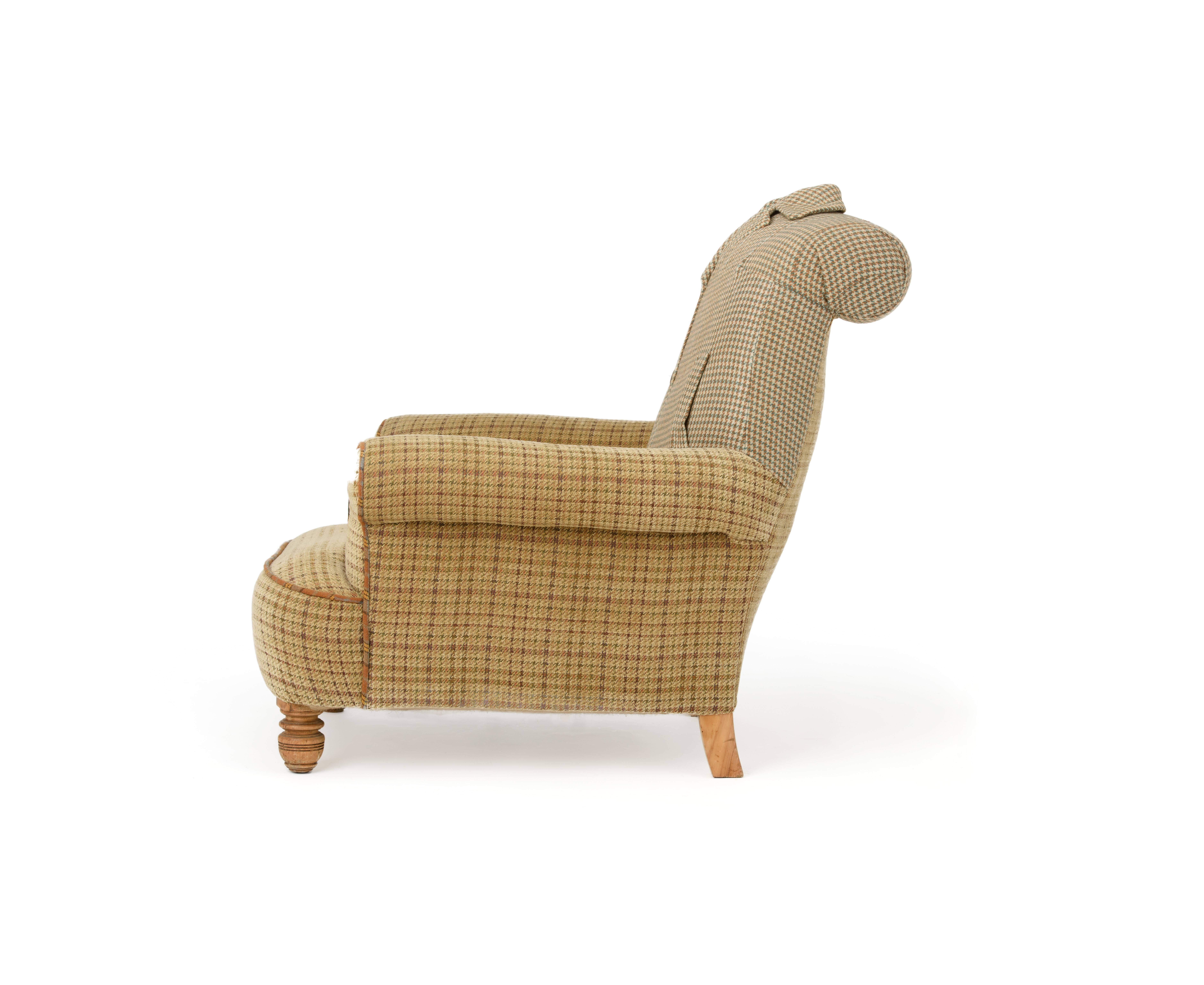Delightful deep seated Victorian armchair reupholstered in an eclectic mix of original Harris Tweed overcoat and matching tweed, ginger tweed piped detail resting on turned wooden legs.