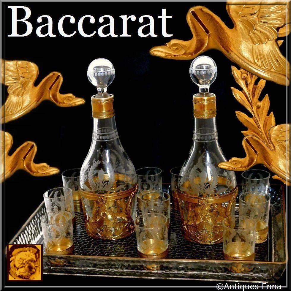 Rare French sterling silver Vermeil 18-karat Baccarat crystal liquor service swans.

The set has fabulous decor with swans, laurel wreaths, ribbons, palmettes and torches. Baccarat mark in relief on the tray. No monogrammed.

The set includes