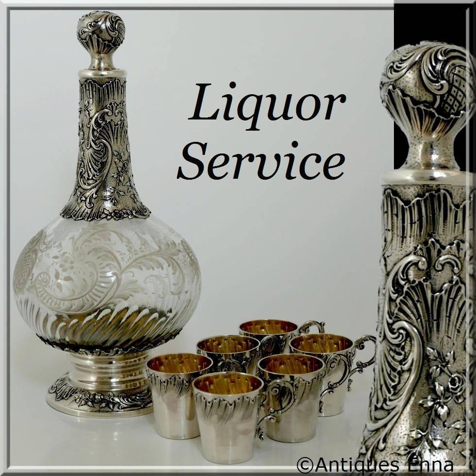 French sterling silver Vermeil Baccarat crystal liquor service seven pieces.

This complete service includes six sterling silver cups with handles and a sterling silver and engraved crystal Baccarat decanter. No monogrammed.

An exceptional set